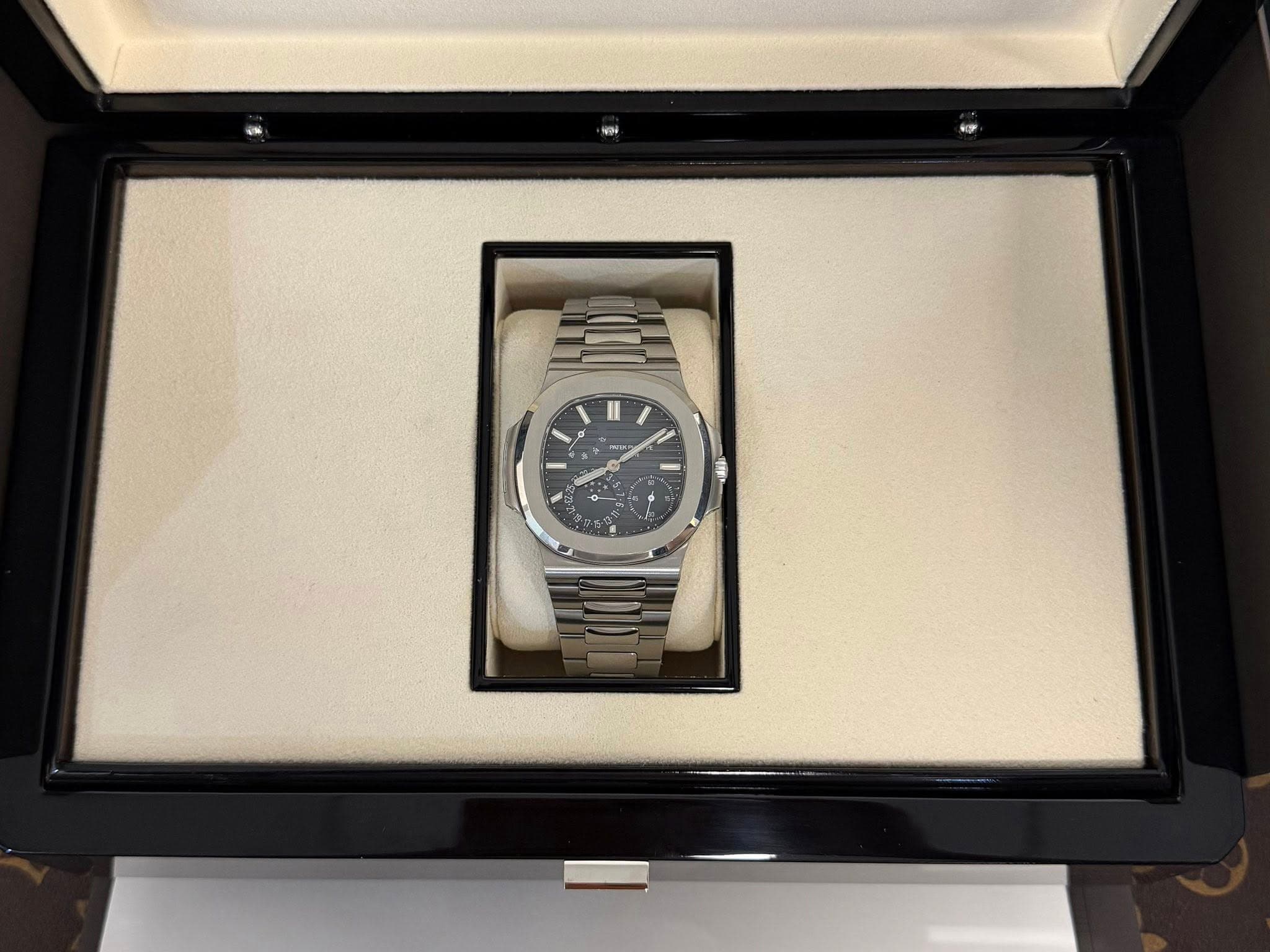 May be an image of wrist watch and text