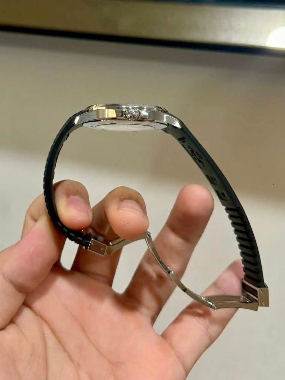 May be an image of wrist watch and jewelry