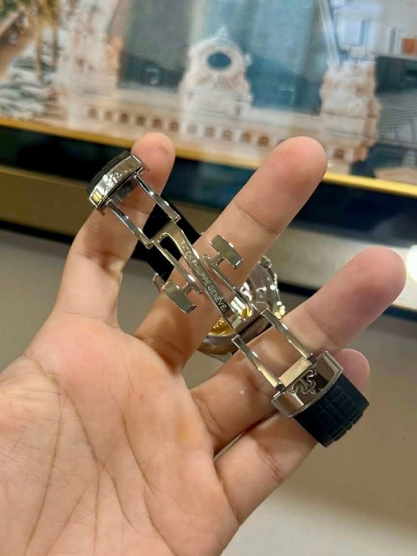 May be an image of brass and wrist watch