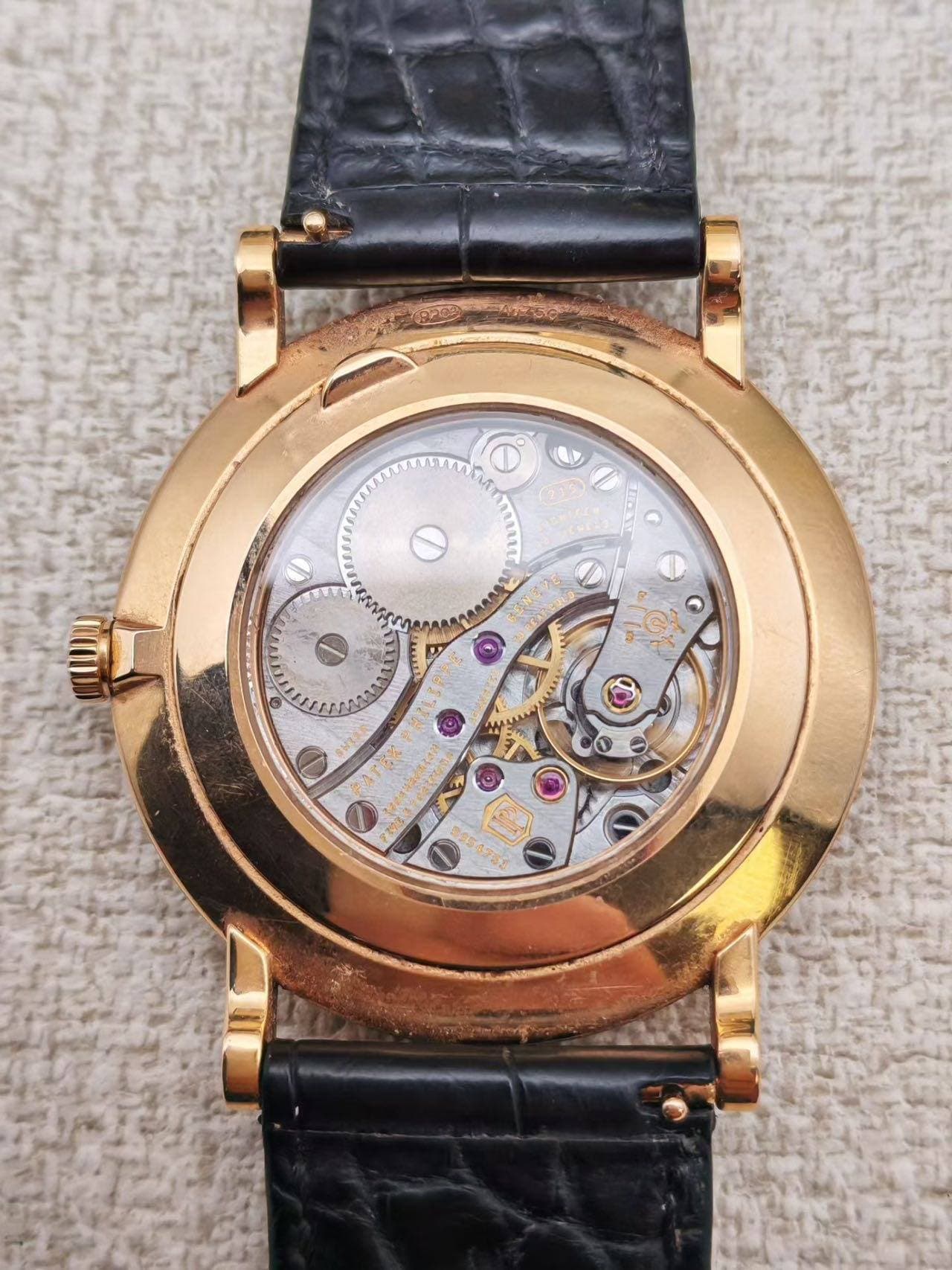 May be an image of wrist watch and text