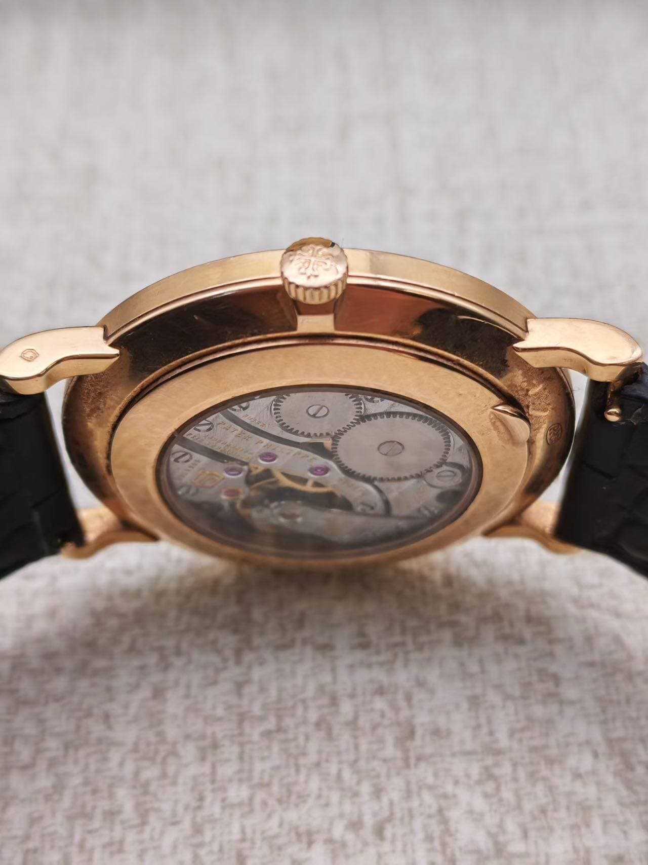 May be an image of wrist watch and text