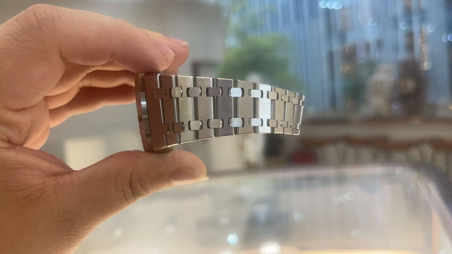 May be an image of wrist watch and text
