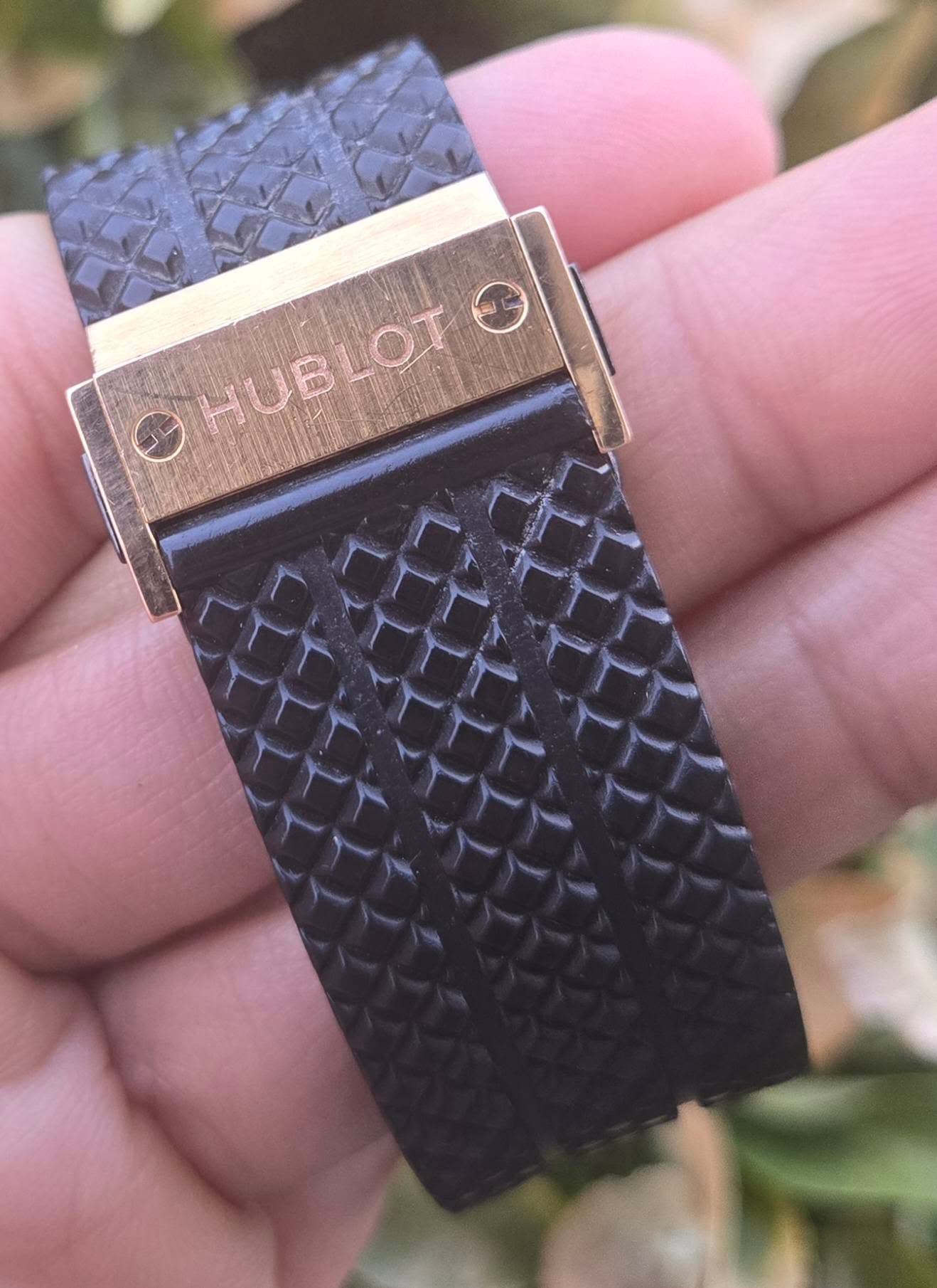 May be an image of digital watch, leather and text that says 'HUBLOT LOT HUB'