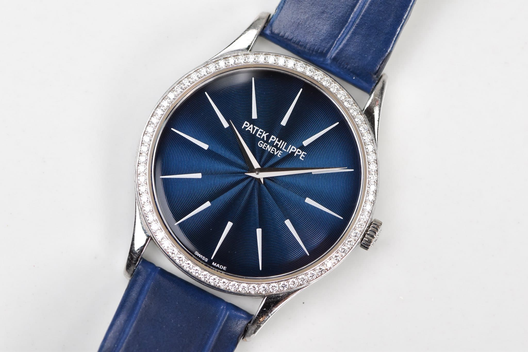 May be an image of wrist watch and text that says 'PATEK PATEKPHILIPPE GENEVE PHILIPPE W/ PHILIPPE IPPE SWISS ร MADE CEDO'