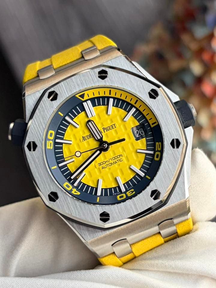 May be an image of wrist watch and text that says 'AUDE + PIGUET 50 a 300m/1 AUTOMATIC 1000ft 300m/1000ft C 0 A 3E E'