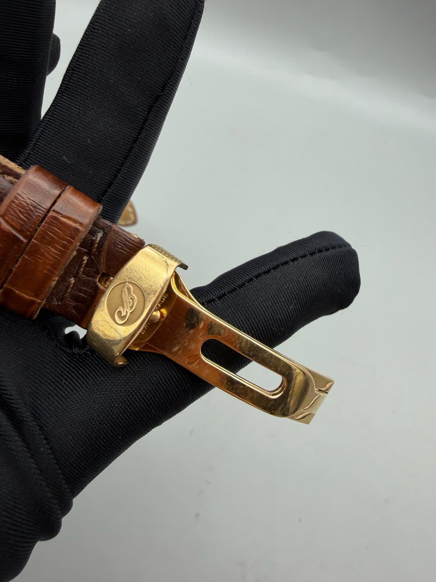 May be an image of brass and wrist watch