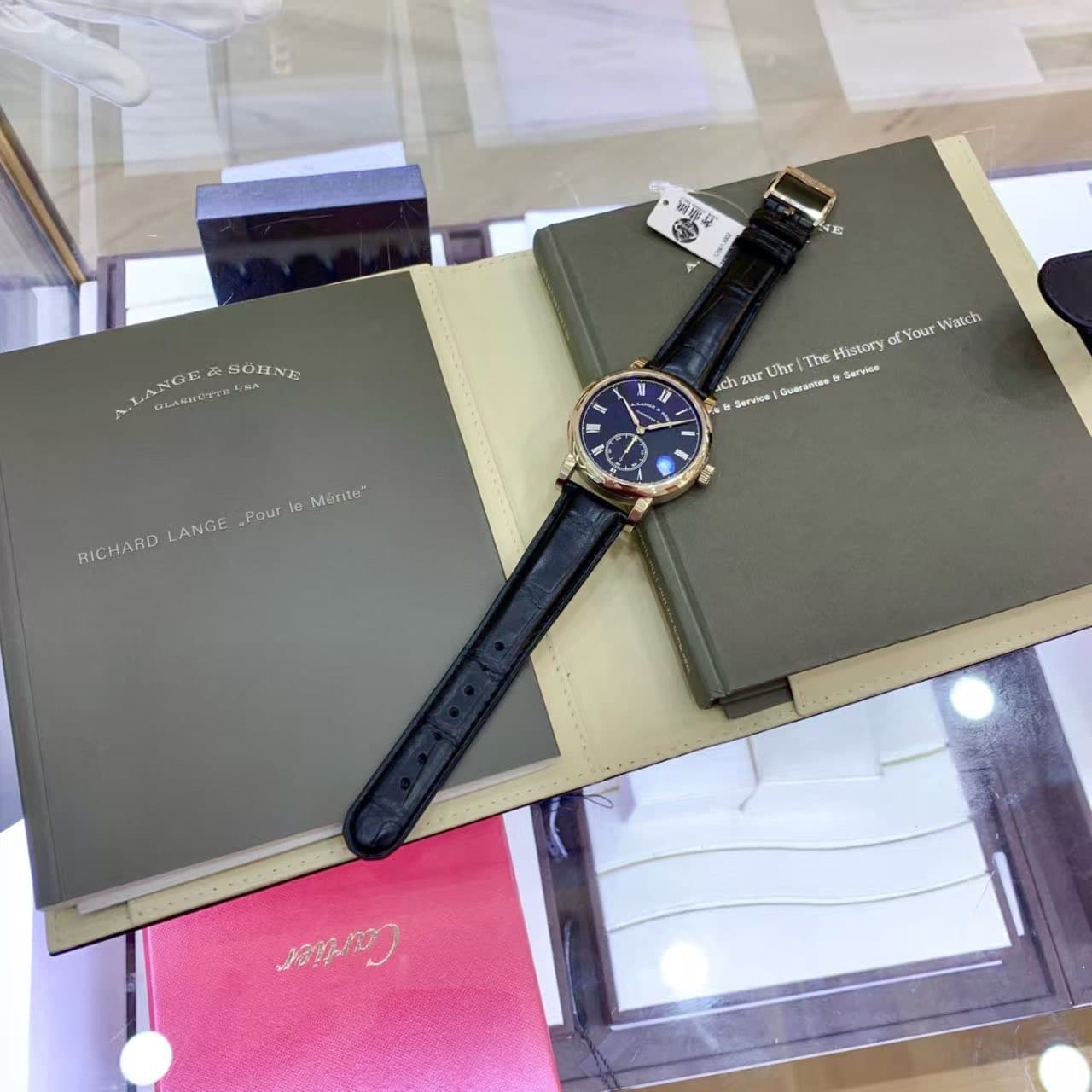 May be an image of wrist watch and text