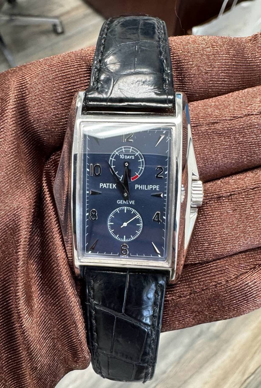 May be an image of wrist watch and text