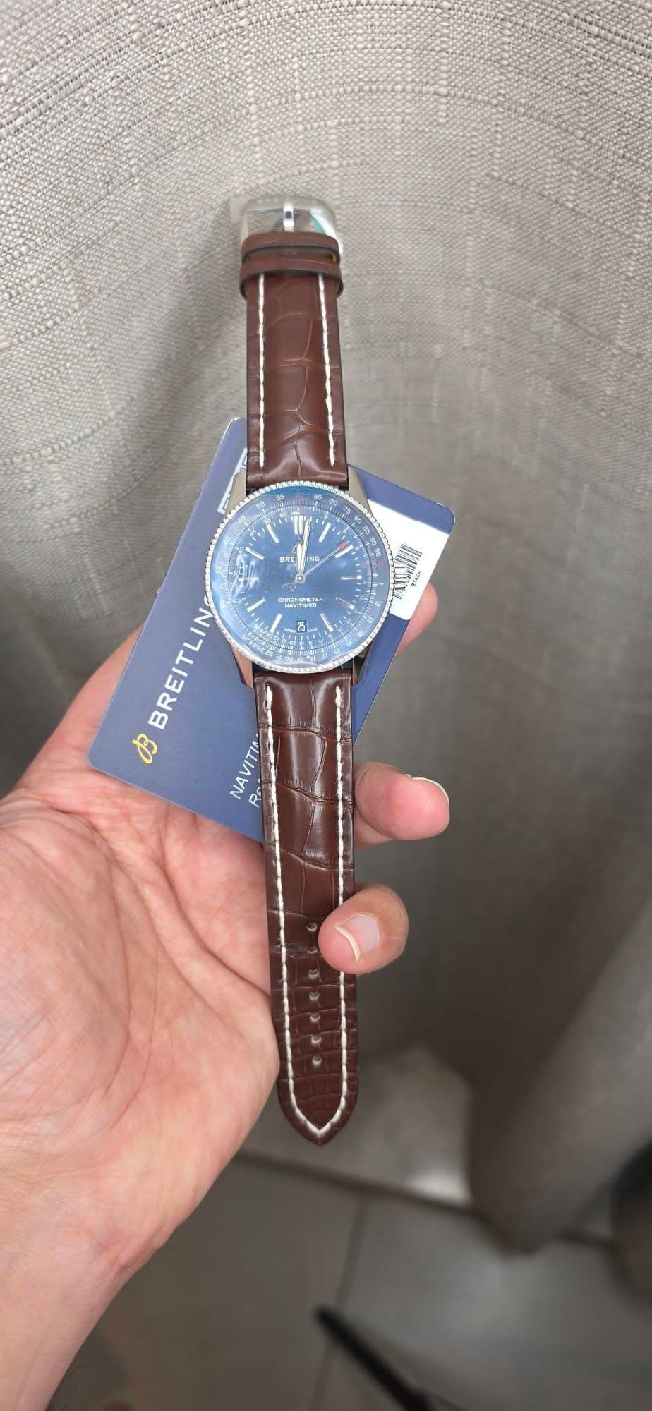 May be an image of wrist watch and text