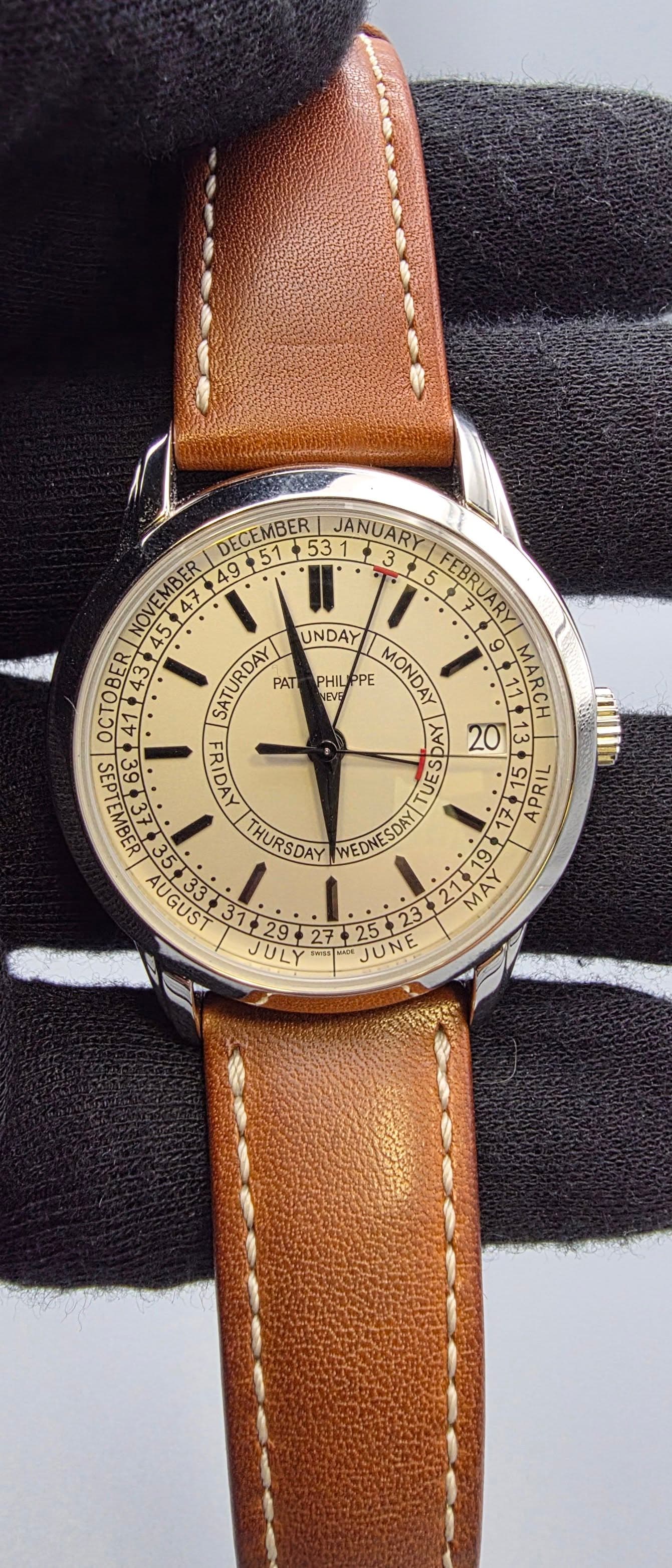 May be an image of leather, wrist watch and text