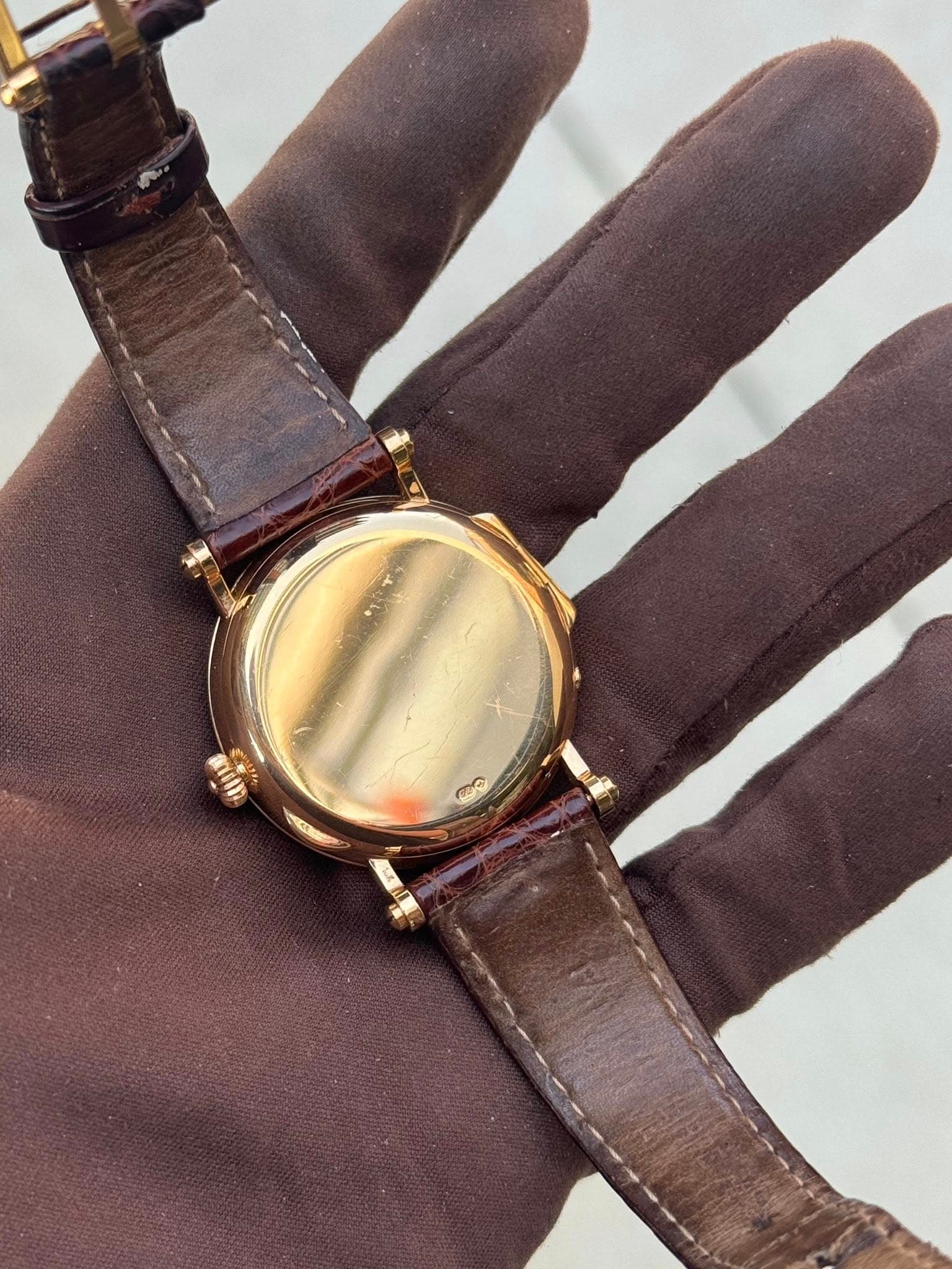 May be an image of brass and wrist watch