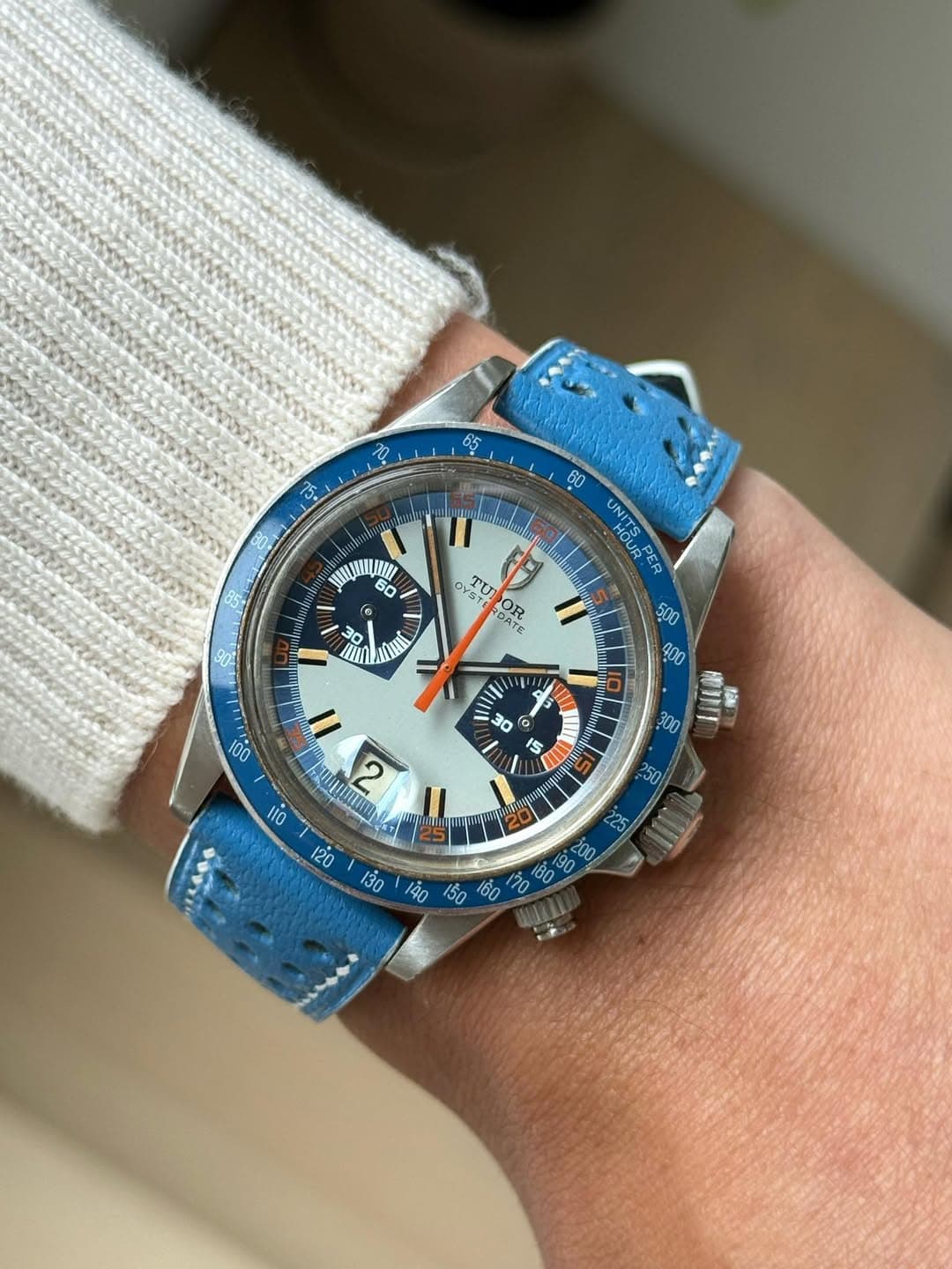 May be an image of wrist watch and text
