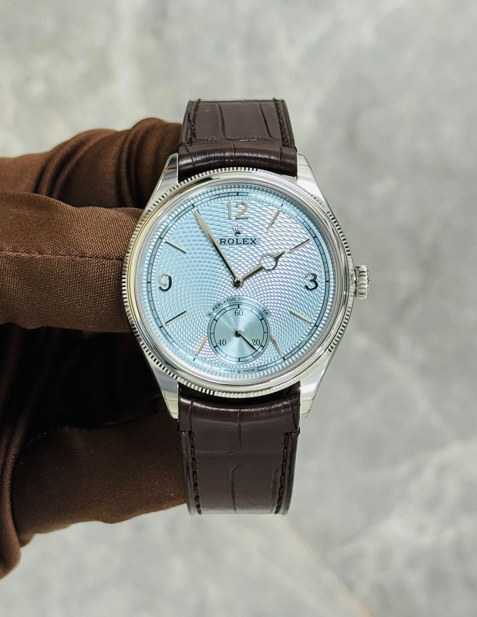 May be an image of wrist watch and text that says '2 ROLEX C'