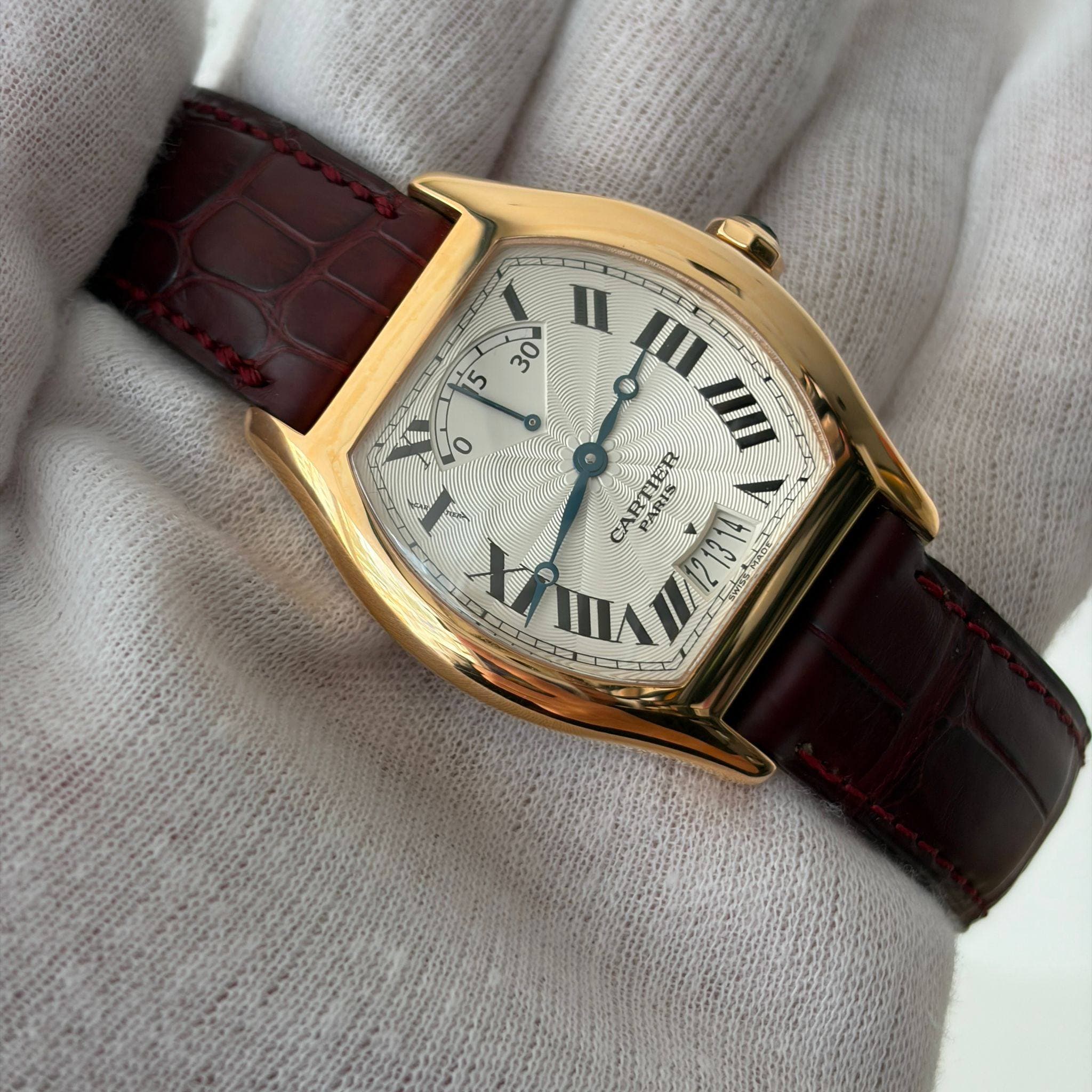 May be an image of wrist watch and text