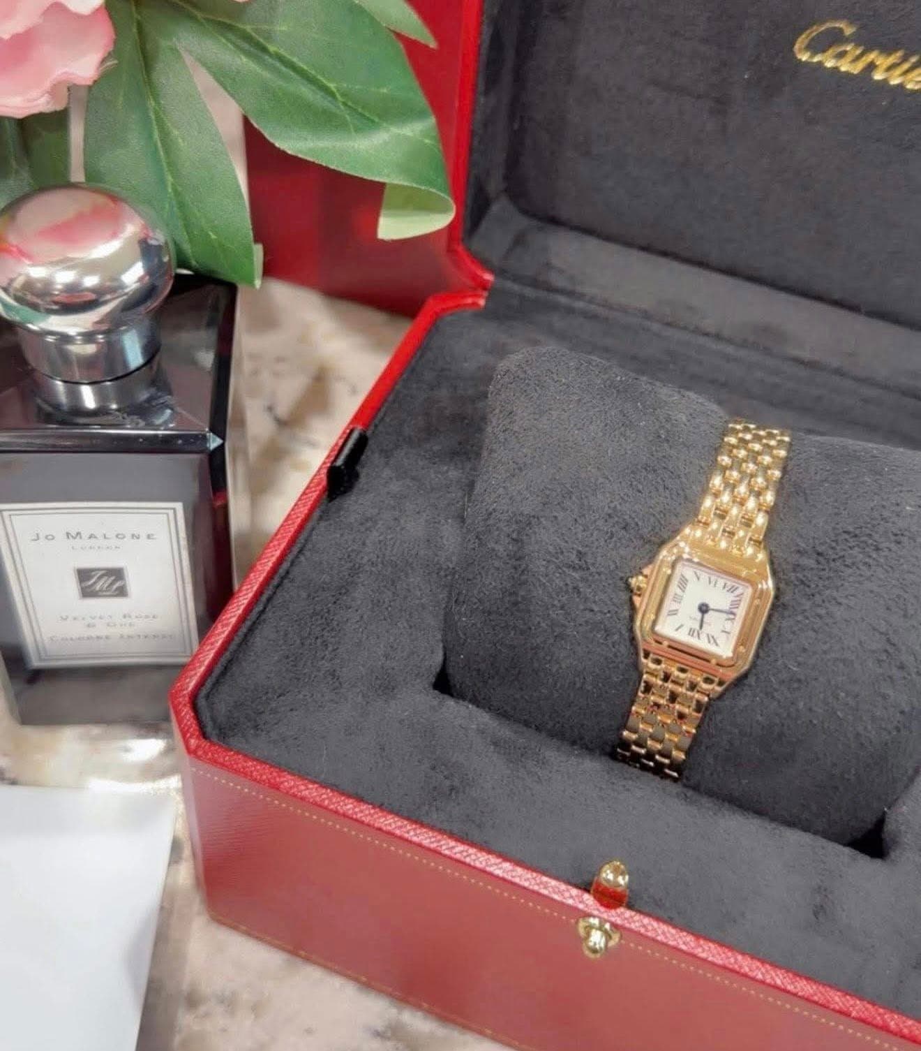 May be an image of wrist watch and text