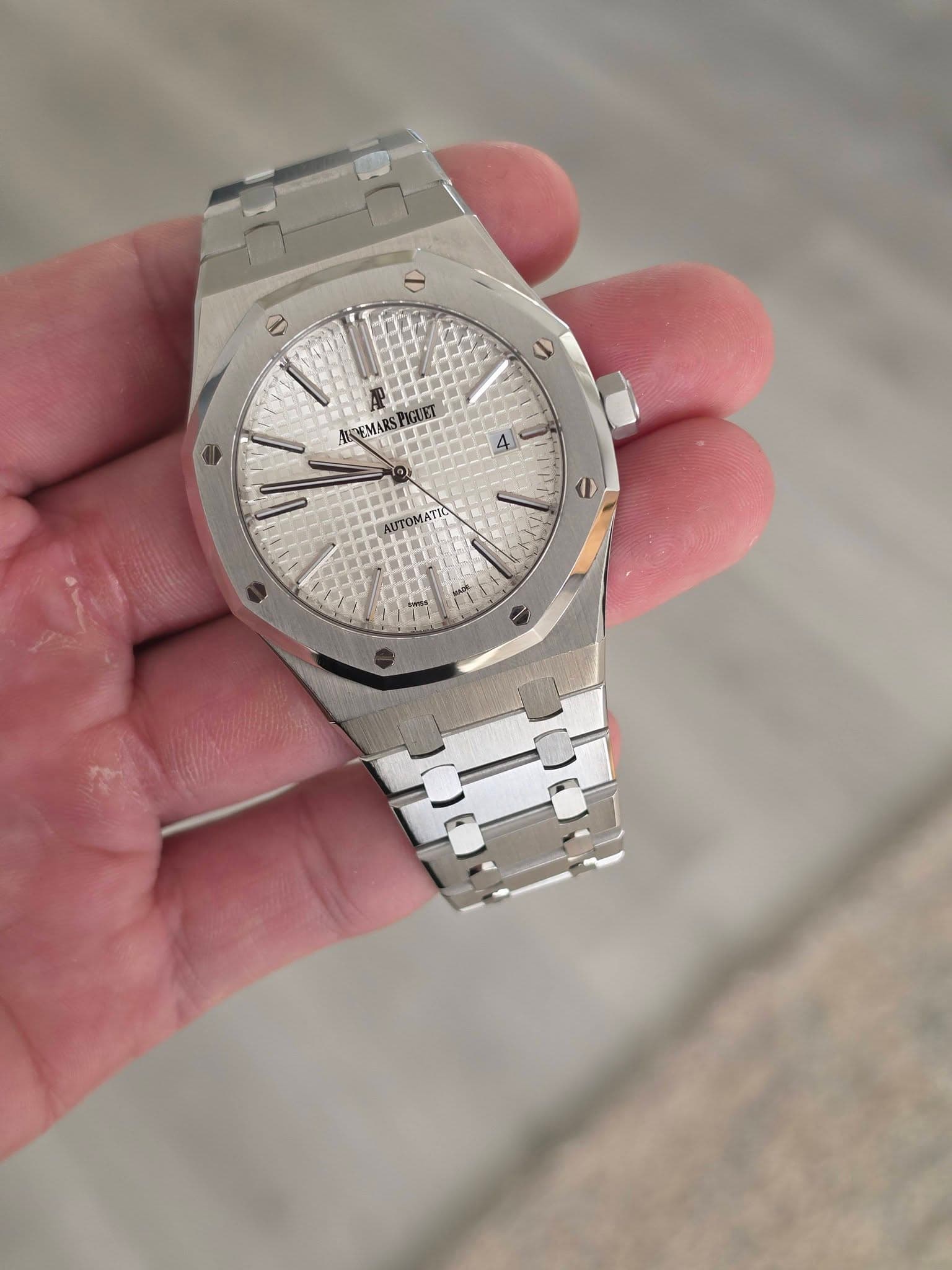 May be an image of wrist watch and text