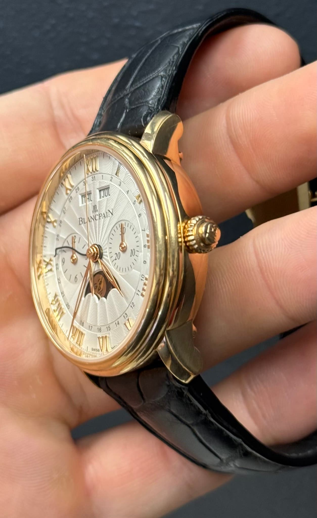 May be an image of wrist watch and text
