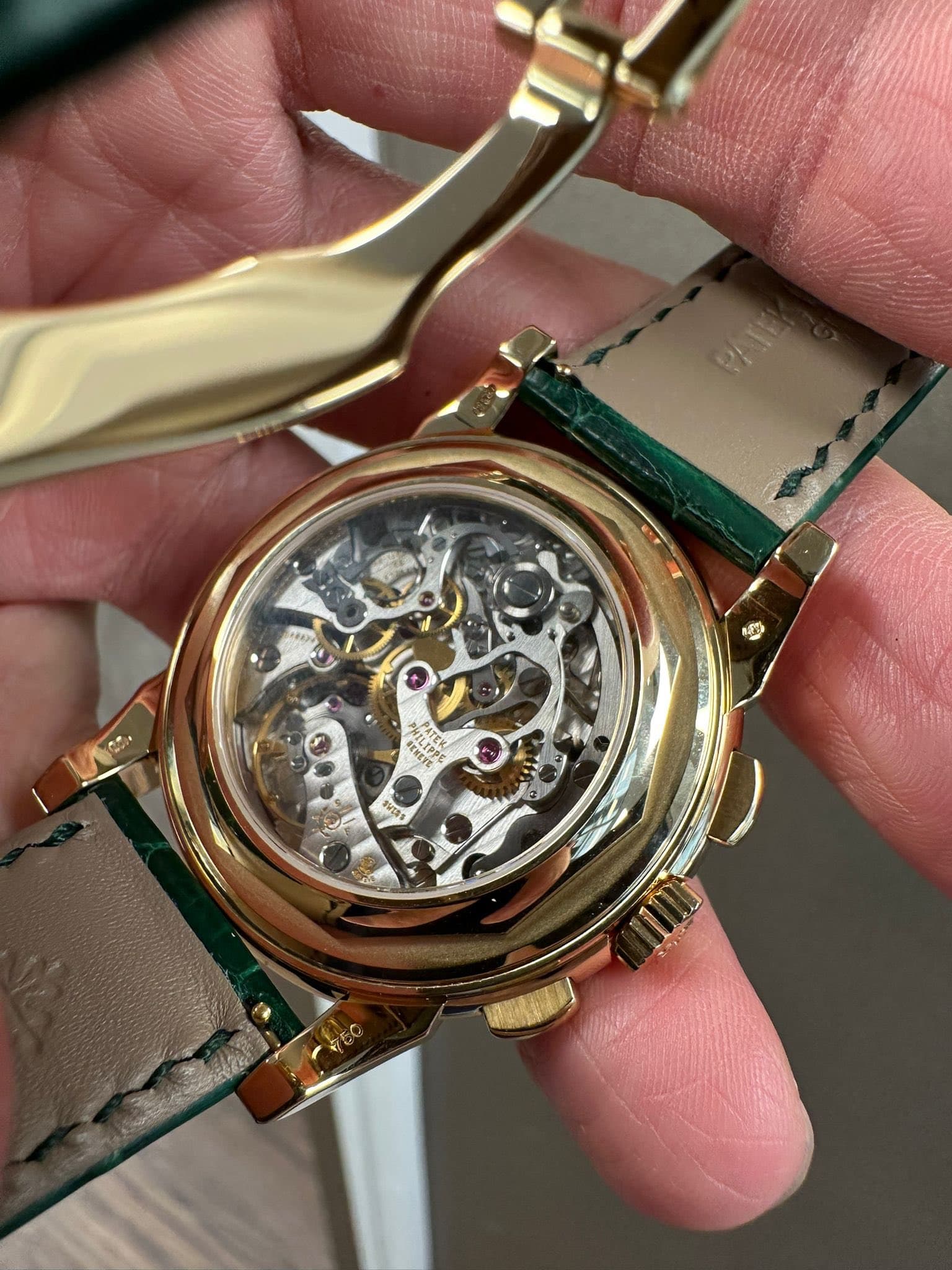 May be an image of wrist watch and text