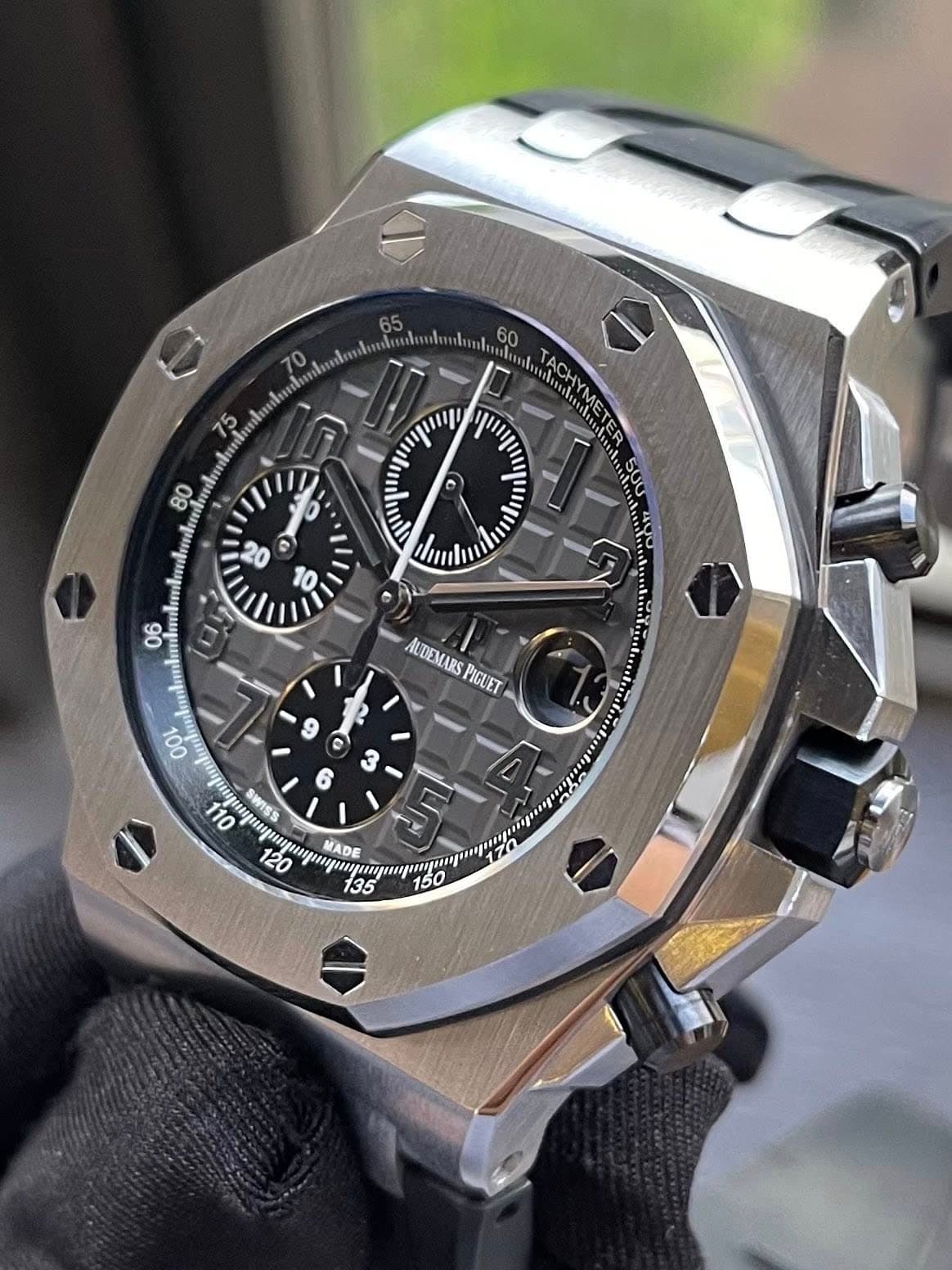 May be an image of wrist watch and text