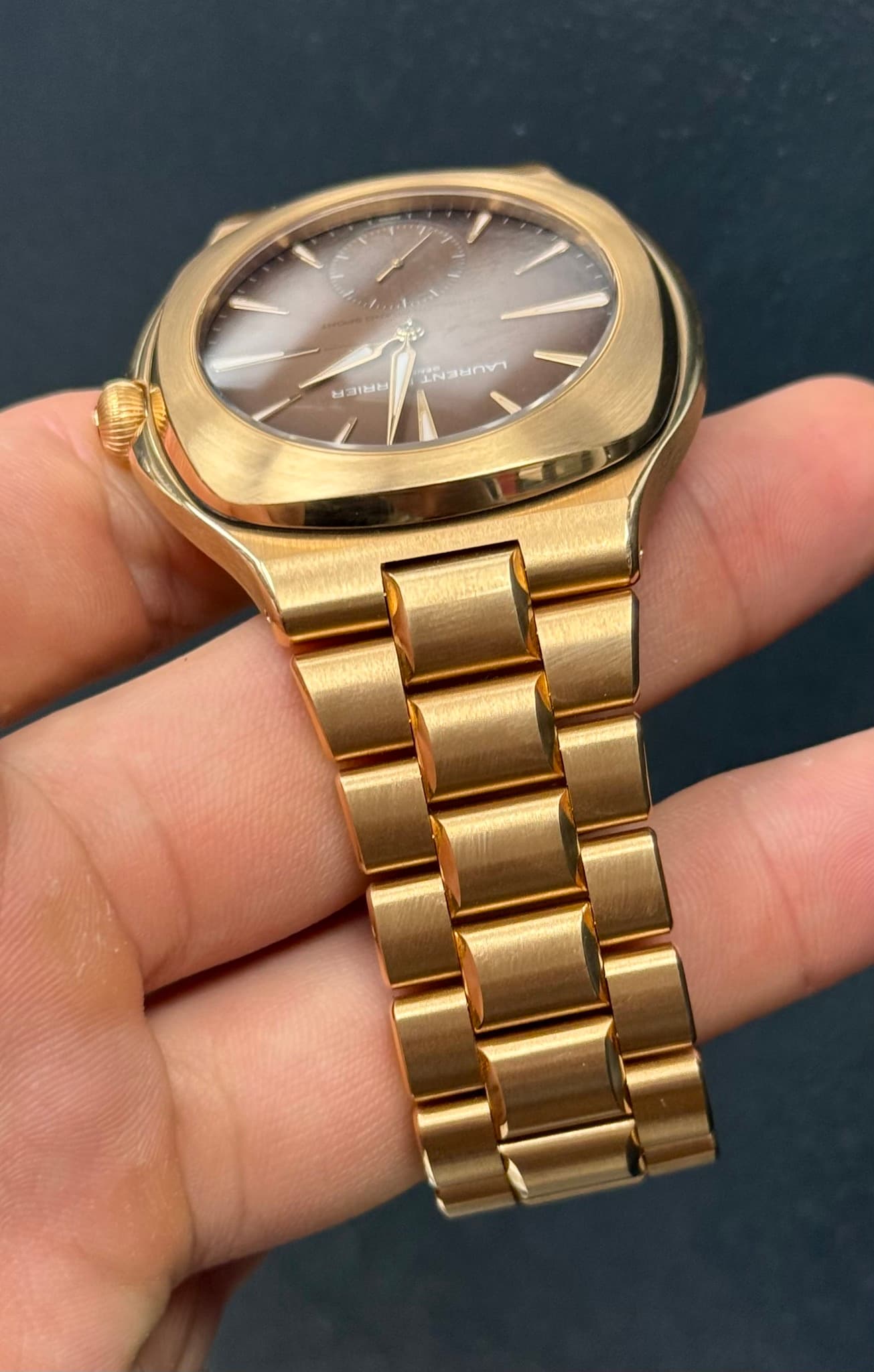 May be an image of wrist watch and text