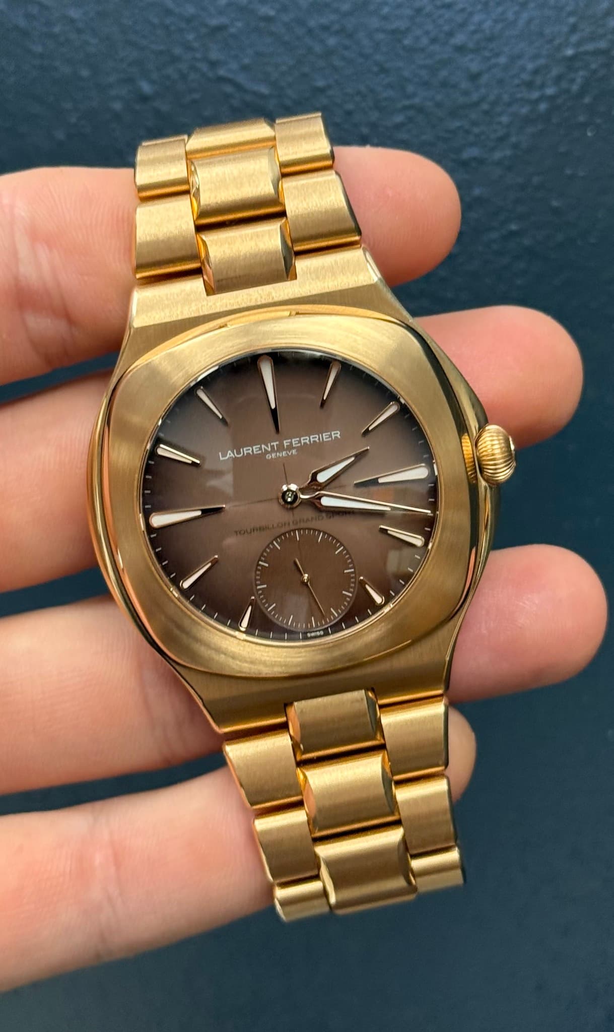 May be an image of wrist watch and text that says 'FERRIER LAURENT GENEVE \'