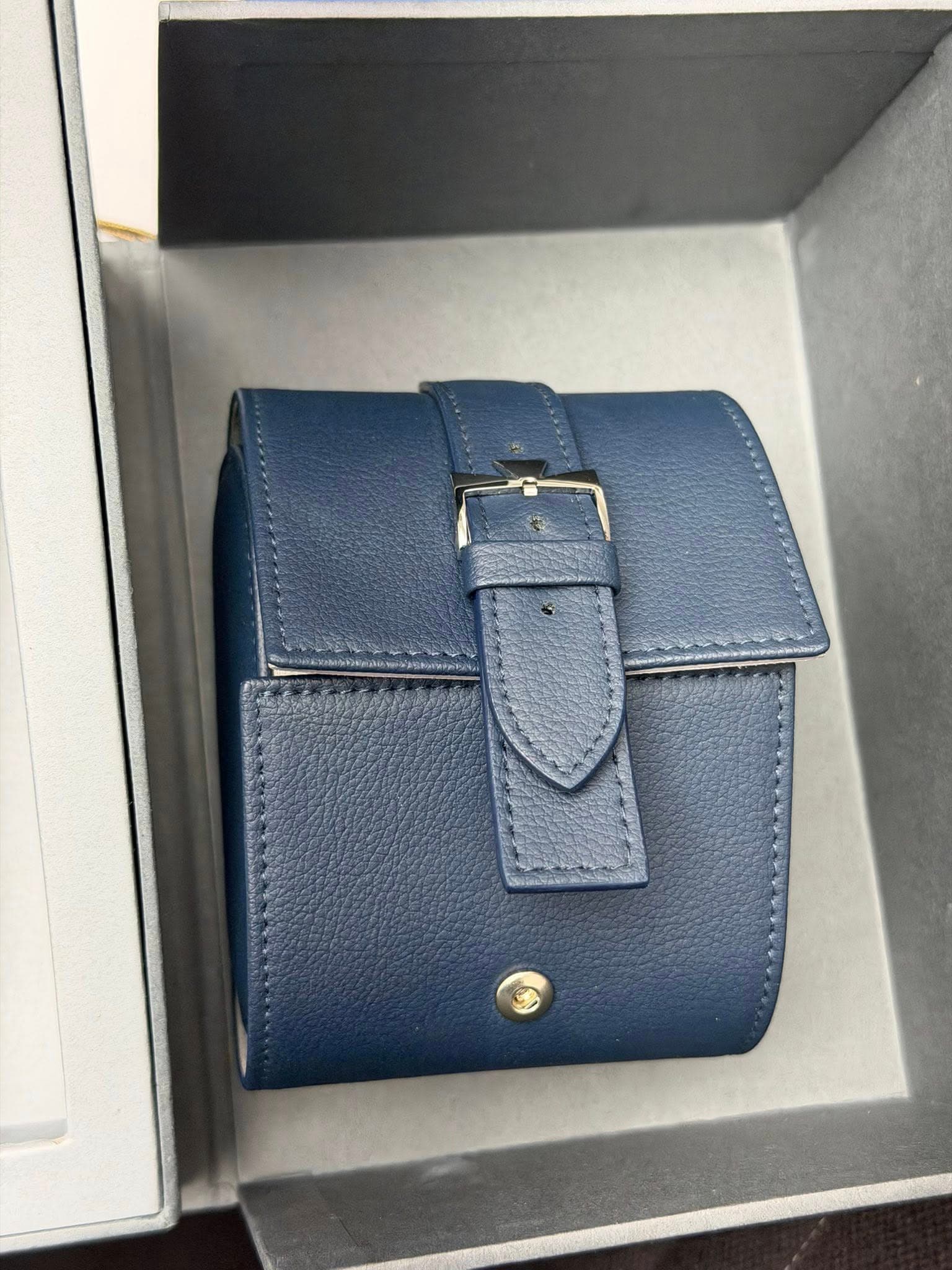 May be an image of leather wallet and text