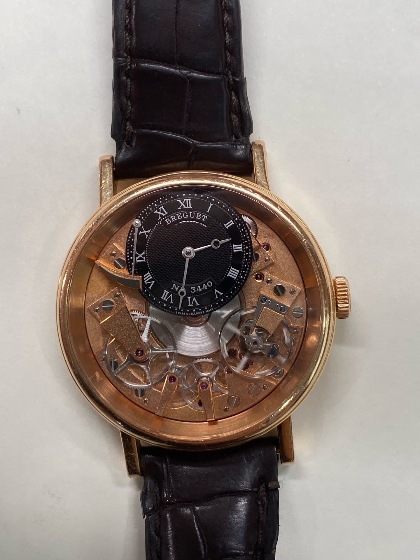 May be an image of wrist watch and text that says 'XI XII I $ BREGUET EGUET - ם 巨 Ⅲ עיד nл'