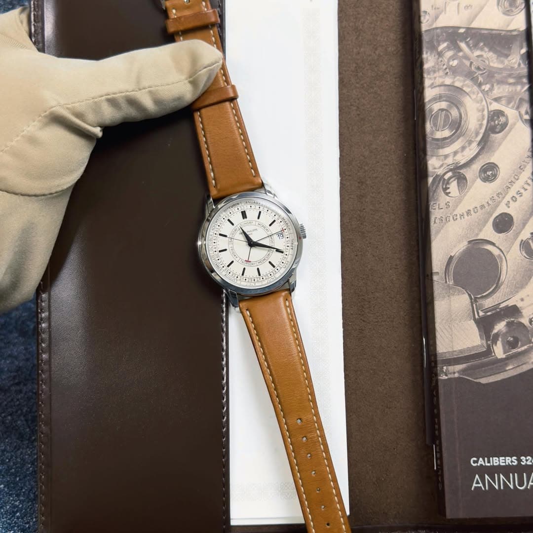 May be an image of wrist watch, leather and text