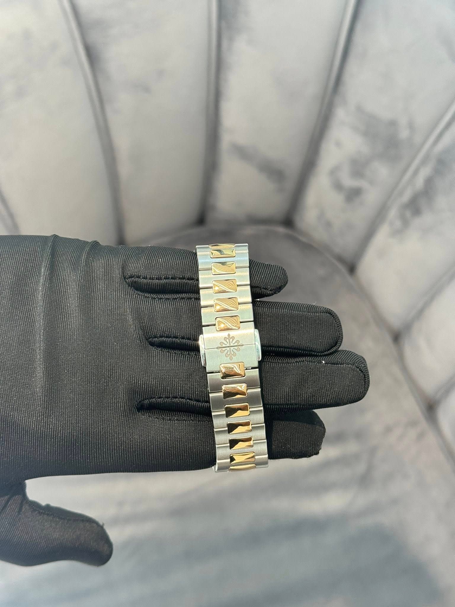 May be an image of jewelry, brass and wrist watch