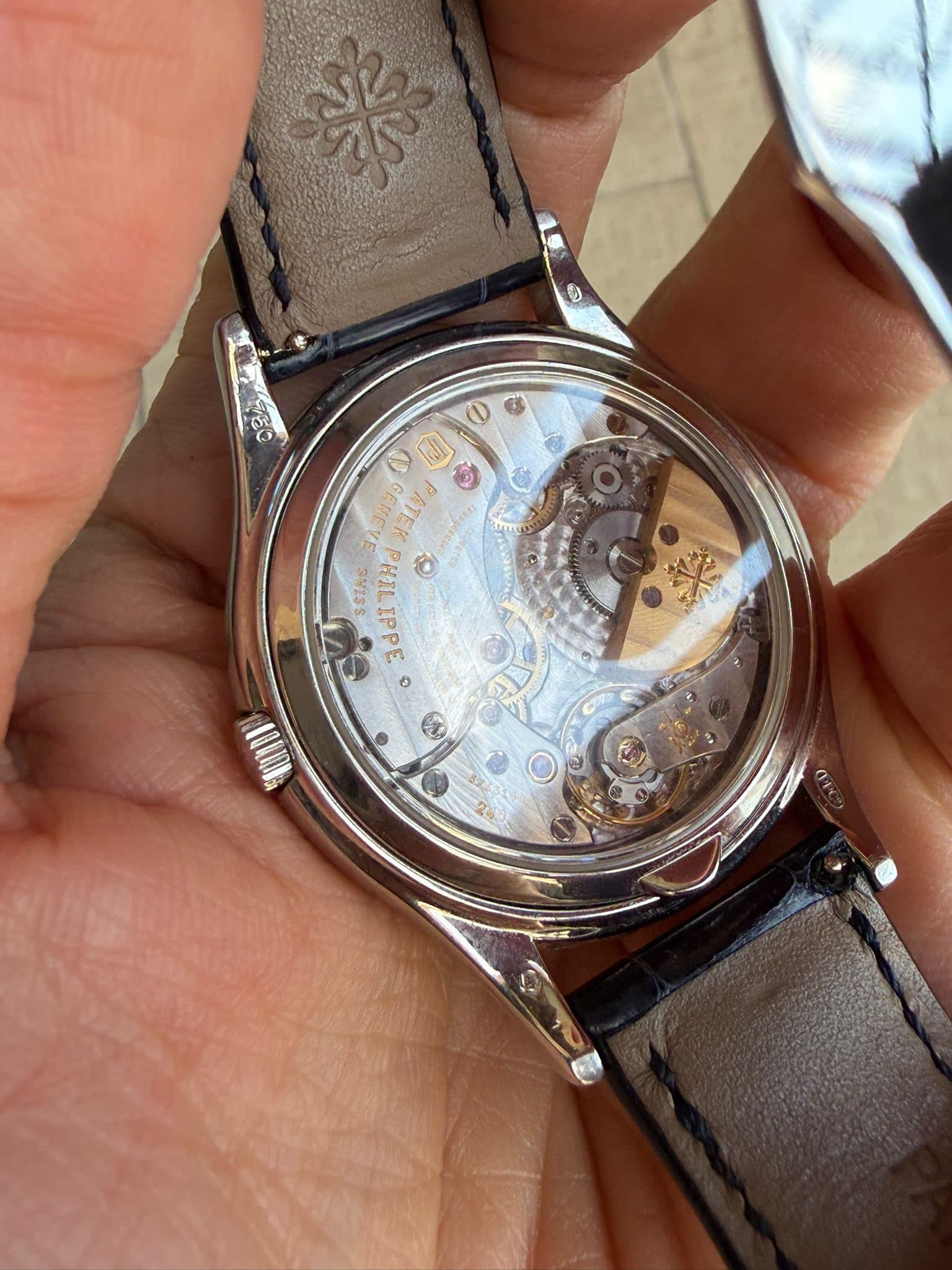 May be an image of wrist watch and text