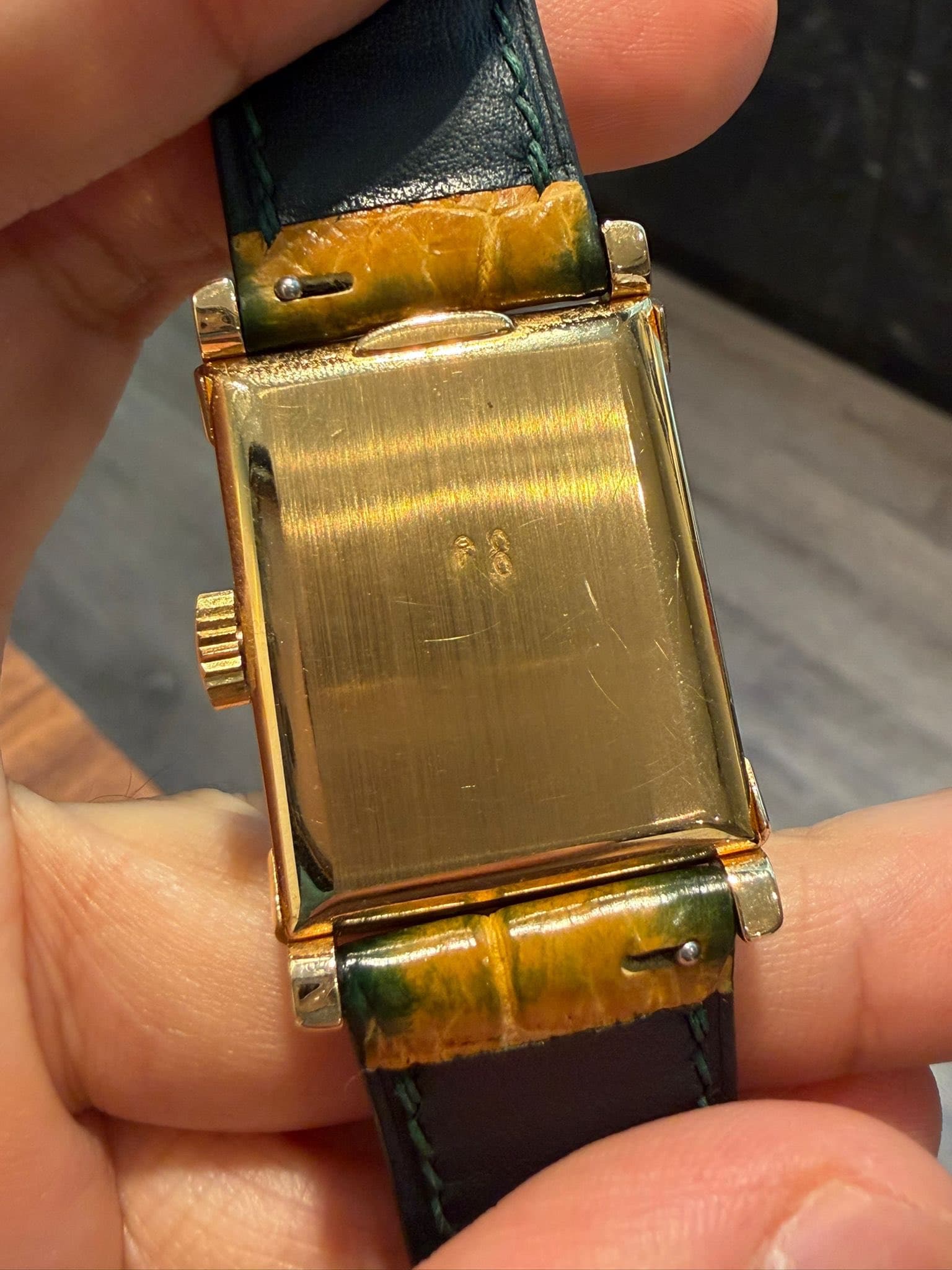 May be an image of wrist watch and text