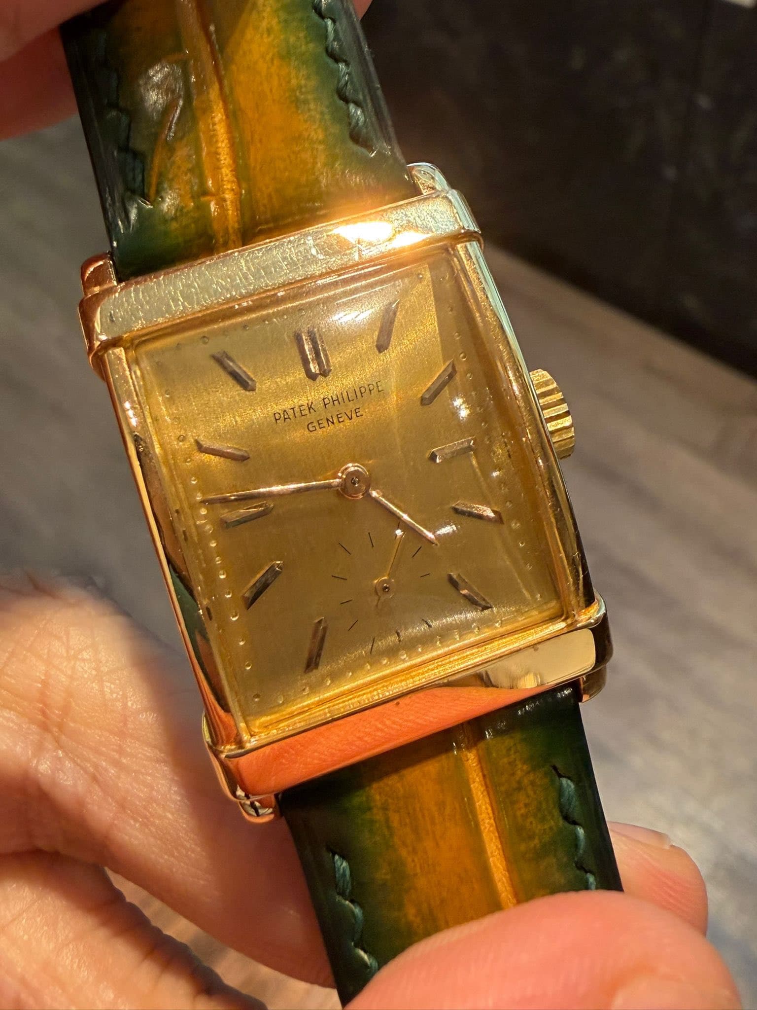 May be an image of wrist watch and text
