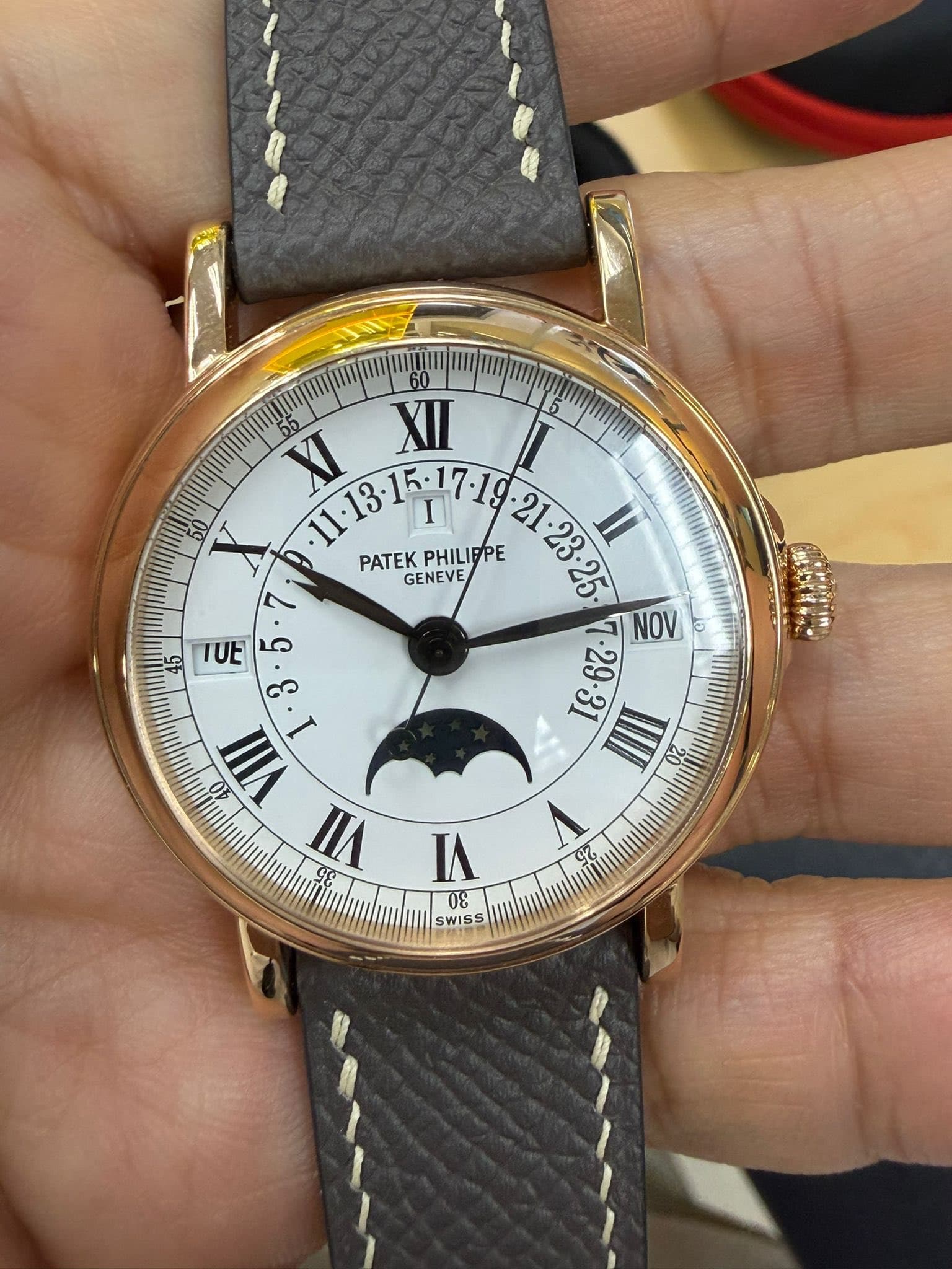 May be an image of wrist watch and text
