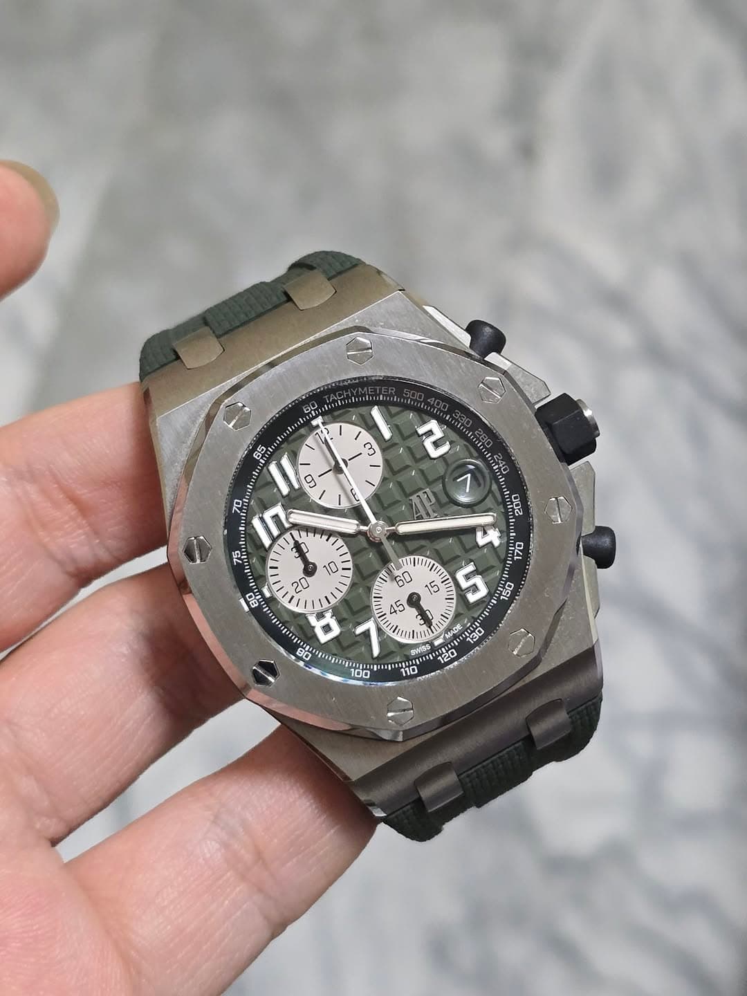 May be an image of wrist watch and text