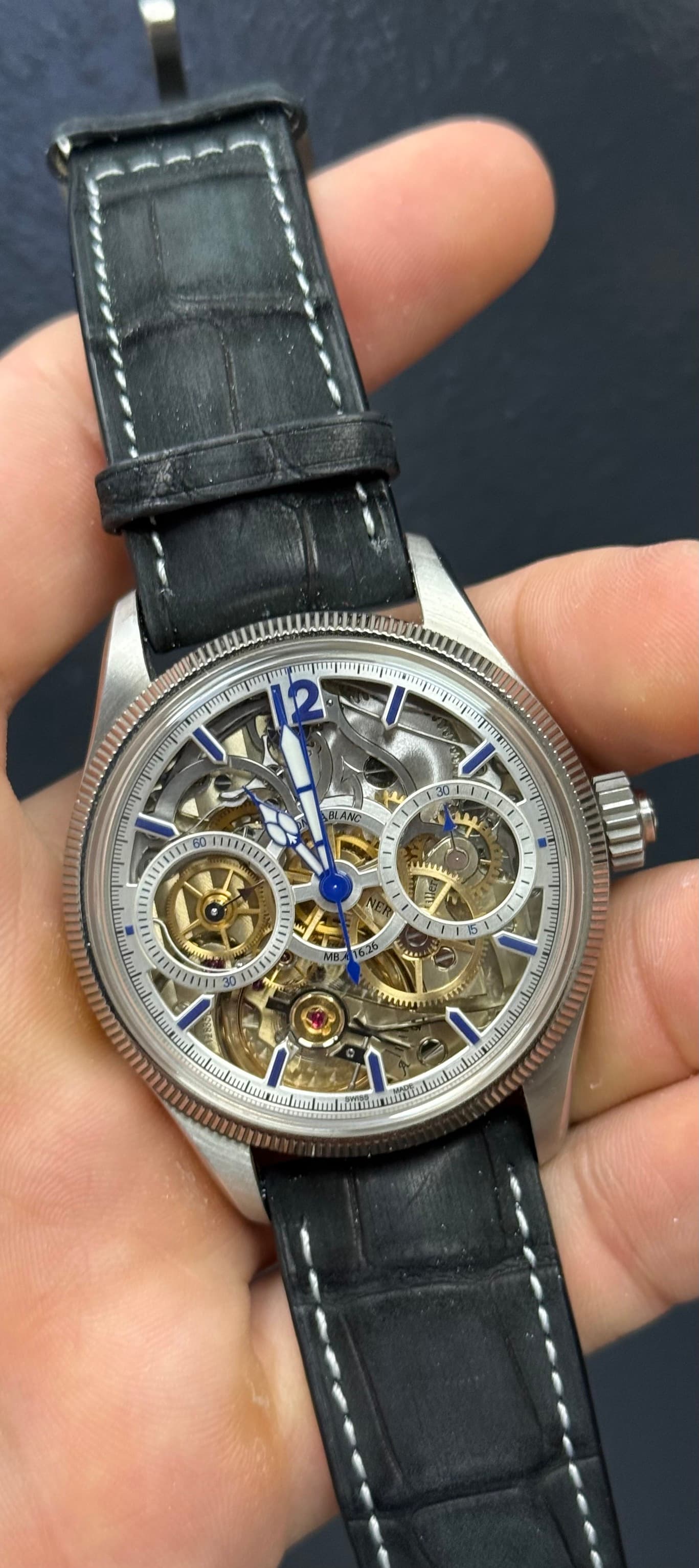 May be an image of wrist watch and text
