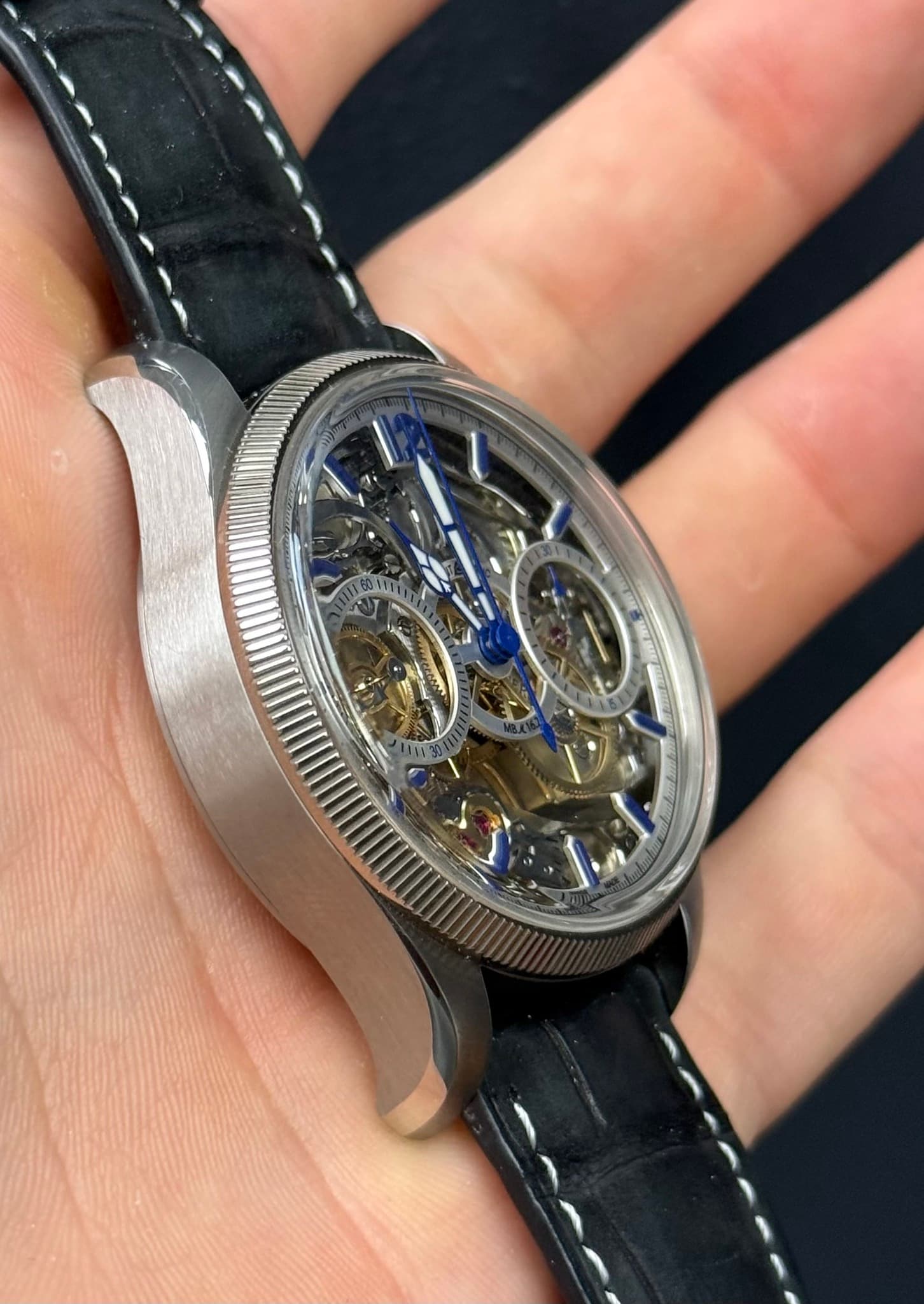 May be an image of wrist watch and text