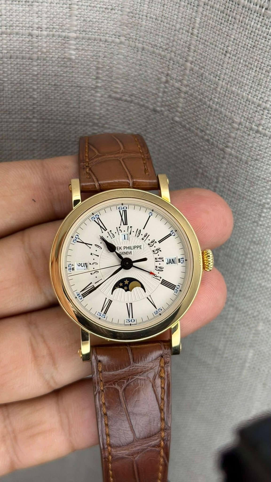 May be an image of wrist watch and text
