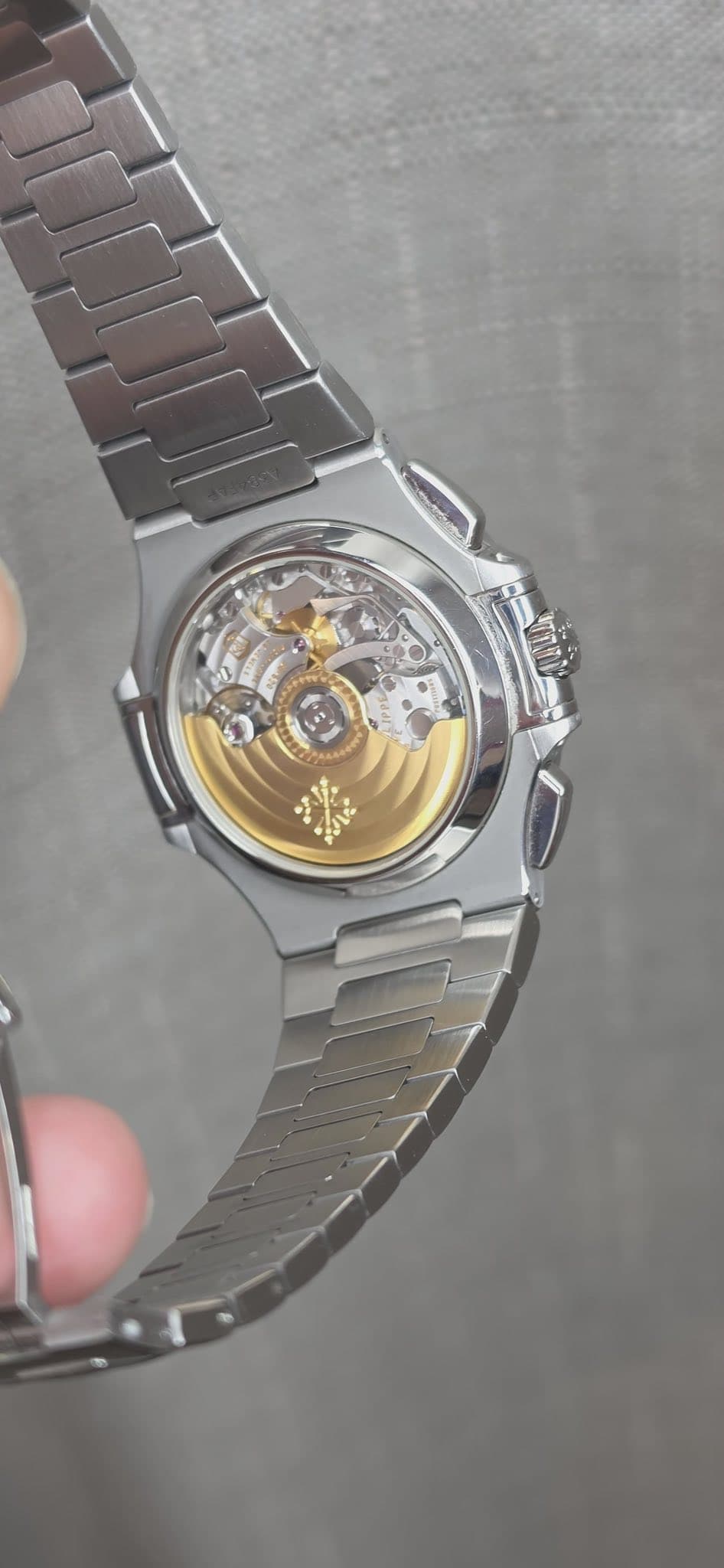 May be an image of wrist watch and text
