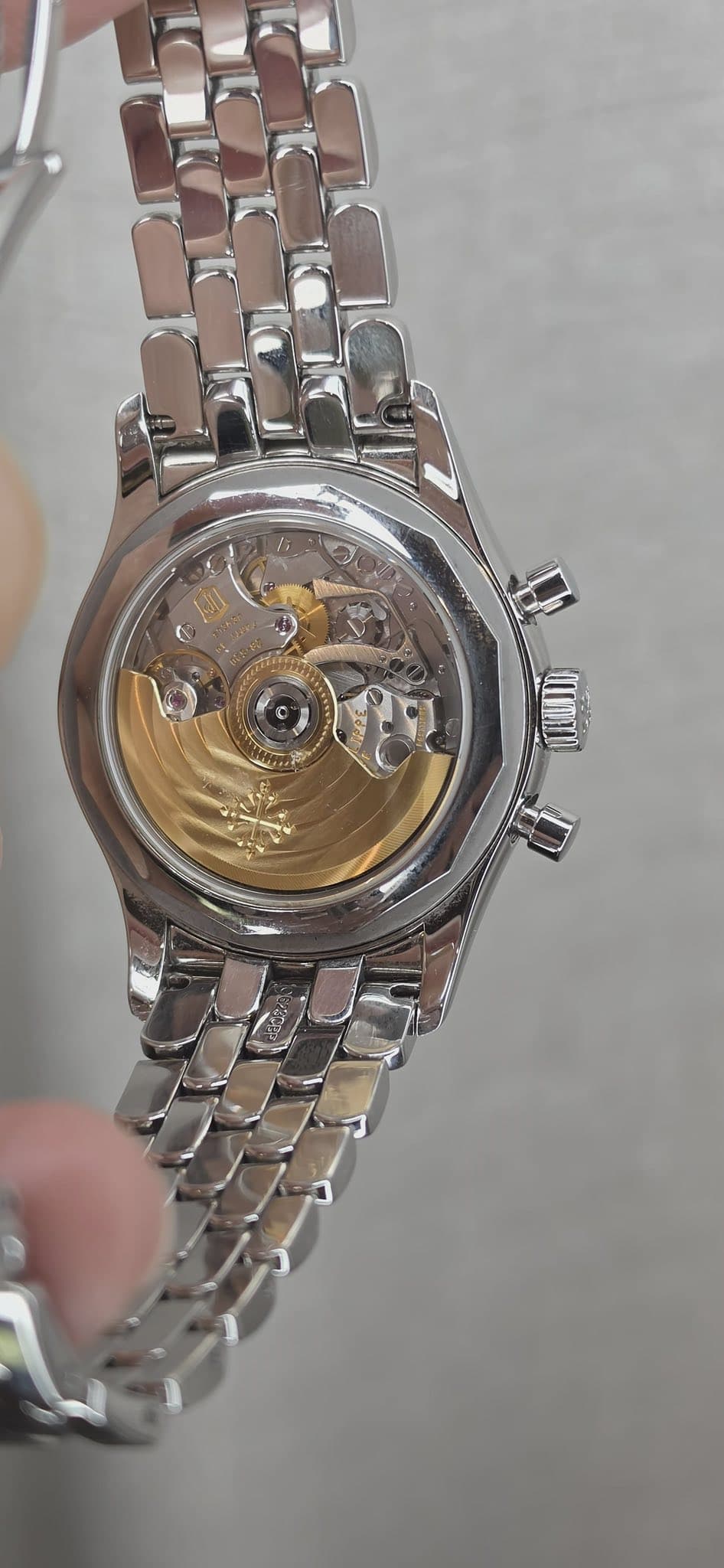 May be an image of wrist watch and text