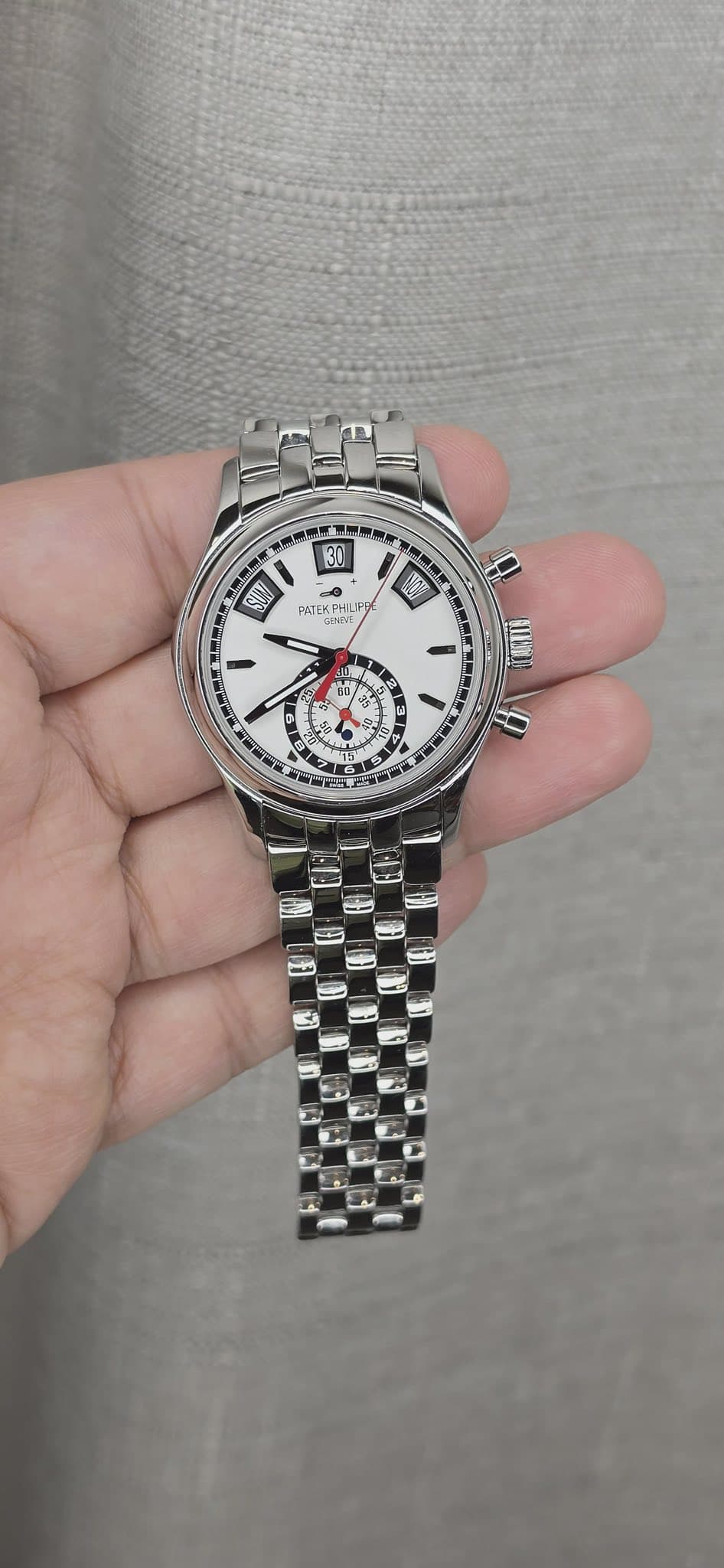 May be an image of wrist watch and text