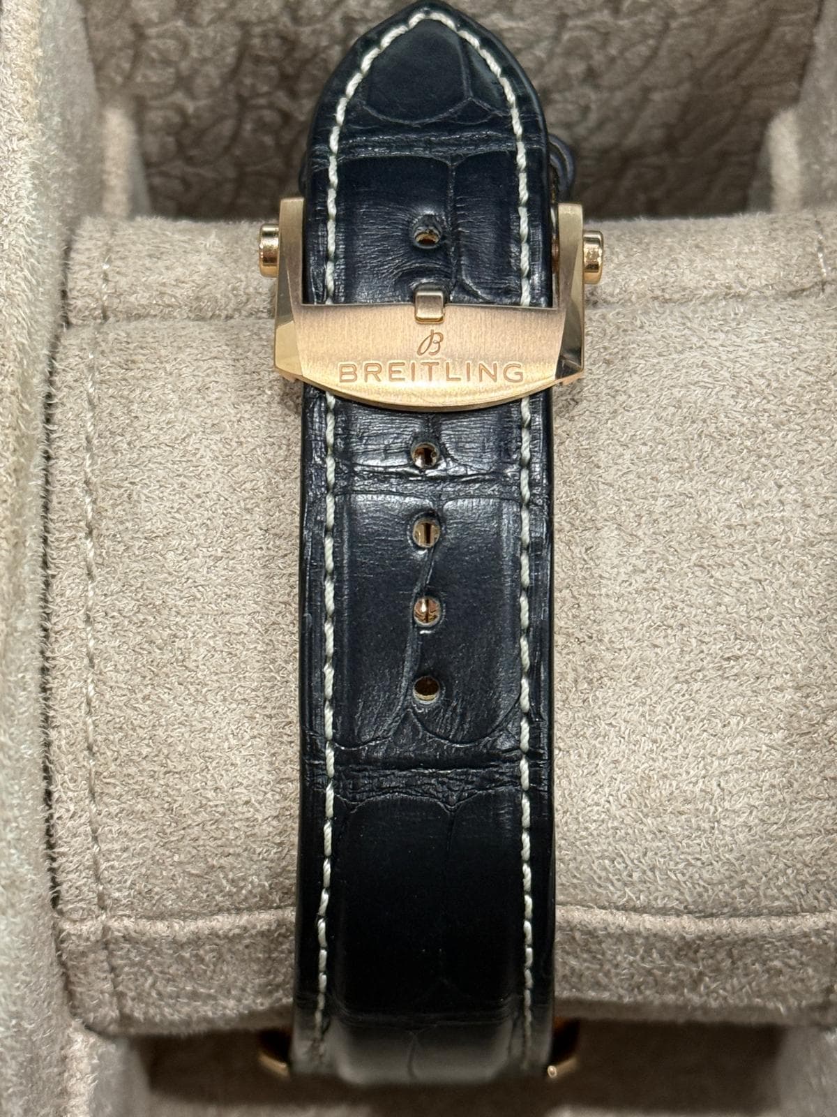 May be an image of wrist watch, leather, saddle-stitched leather and text that says 'の BREITLING'
