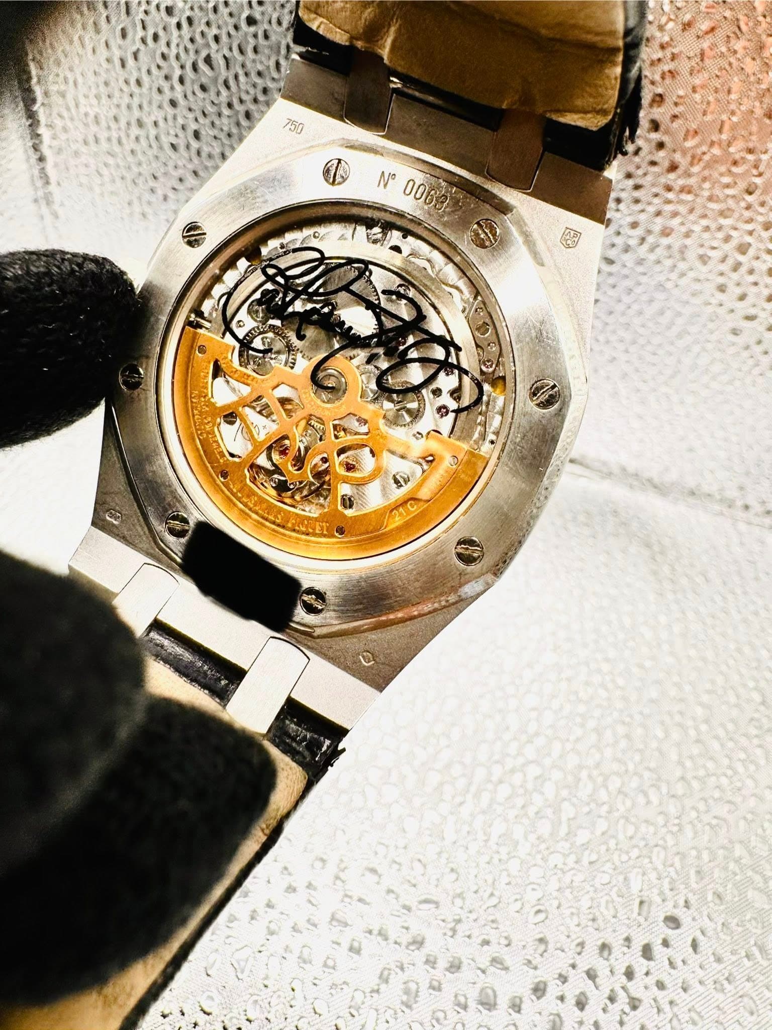 May be an image of wrist watch and text