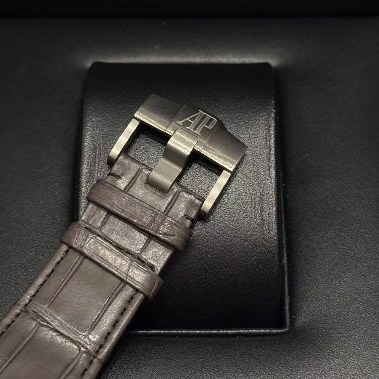 May be an image of leather, saddle-stitched leather and wrist watch