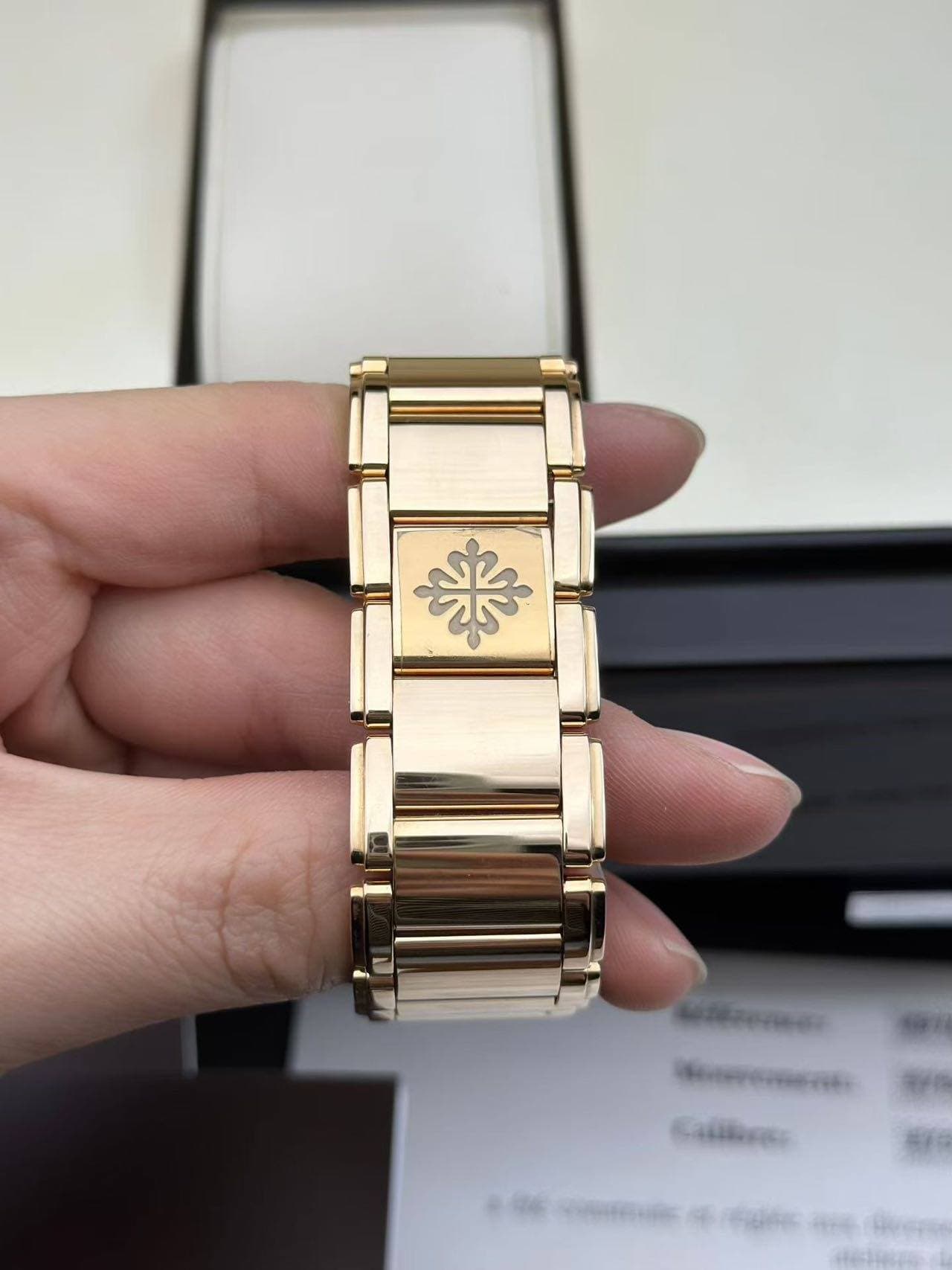 May be an image of wrist watch and text