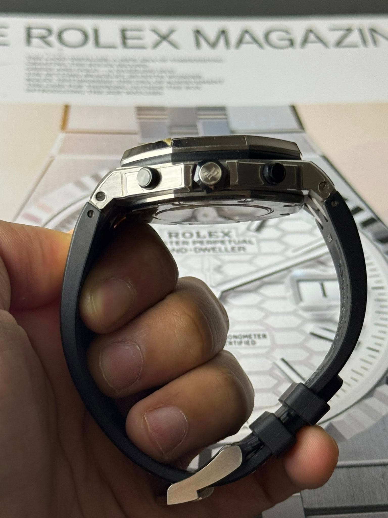 May be an image of wrist watch and text