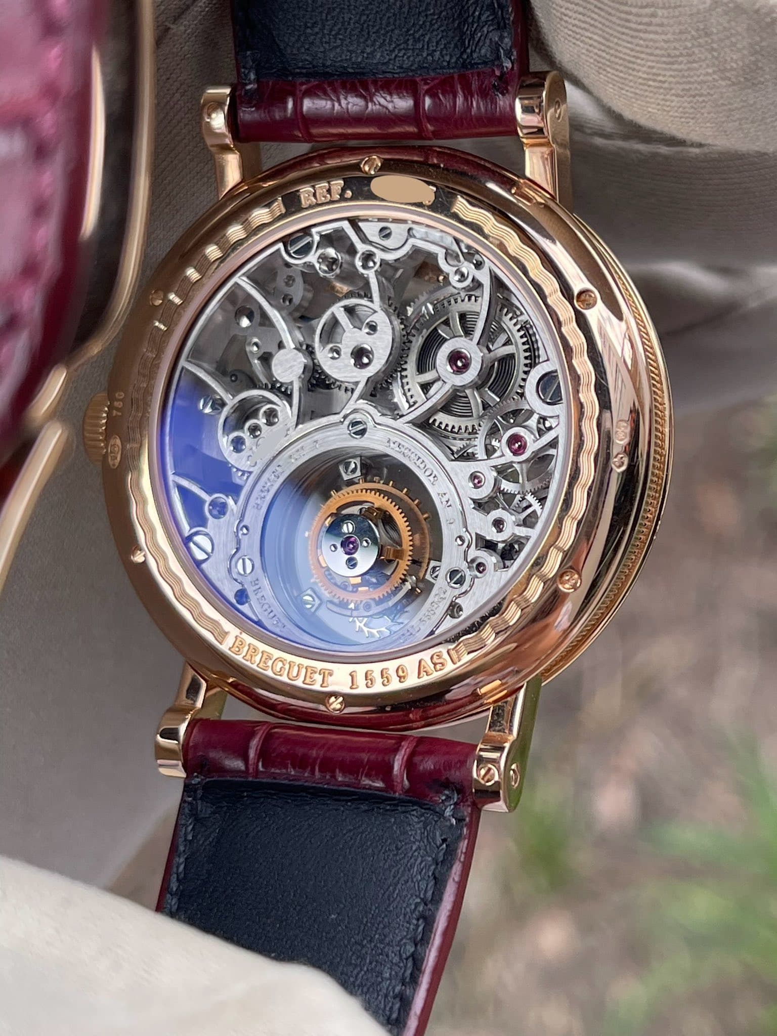 May be an image of wrist watch and text