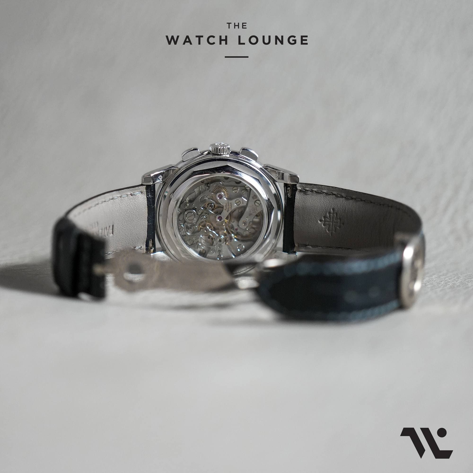 May be an image of wrist watch and text that says 'THE WATCHLOUNGE WATCH LOUNGE لا'
