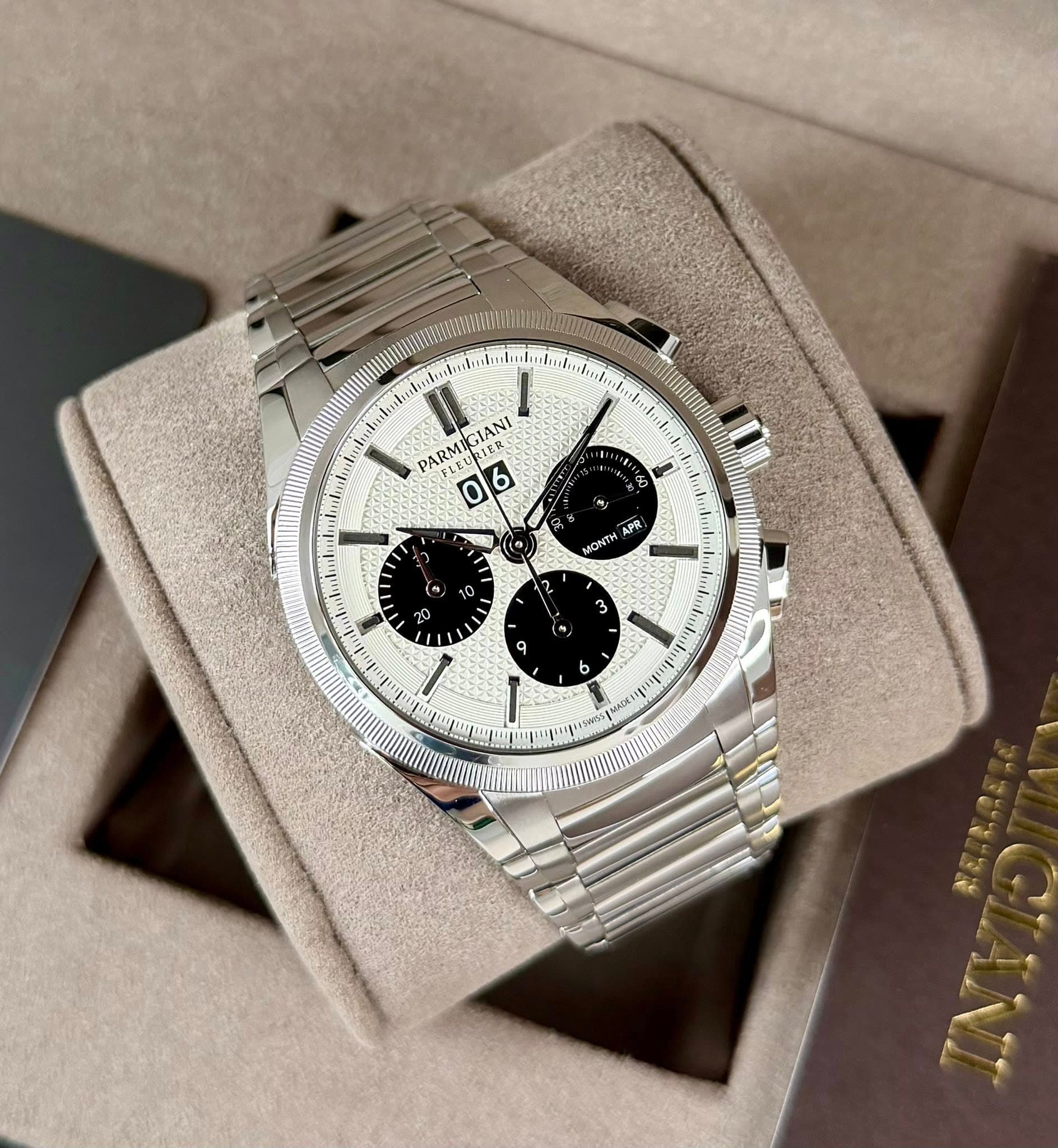 May be an image of wrist watch and text that says 'PARMIGIANI GIANI 06 0 6 ಓ (១ አያጲ፡ ONTH " 9 / I ٩'