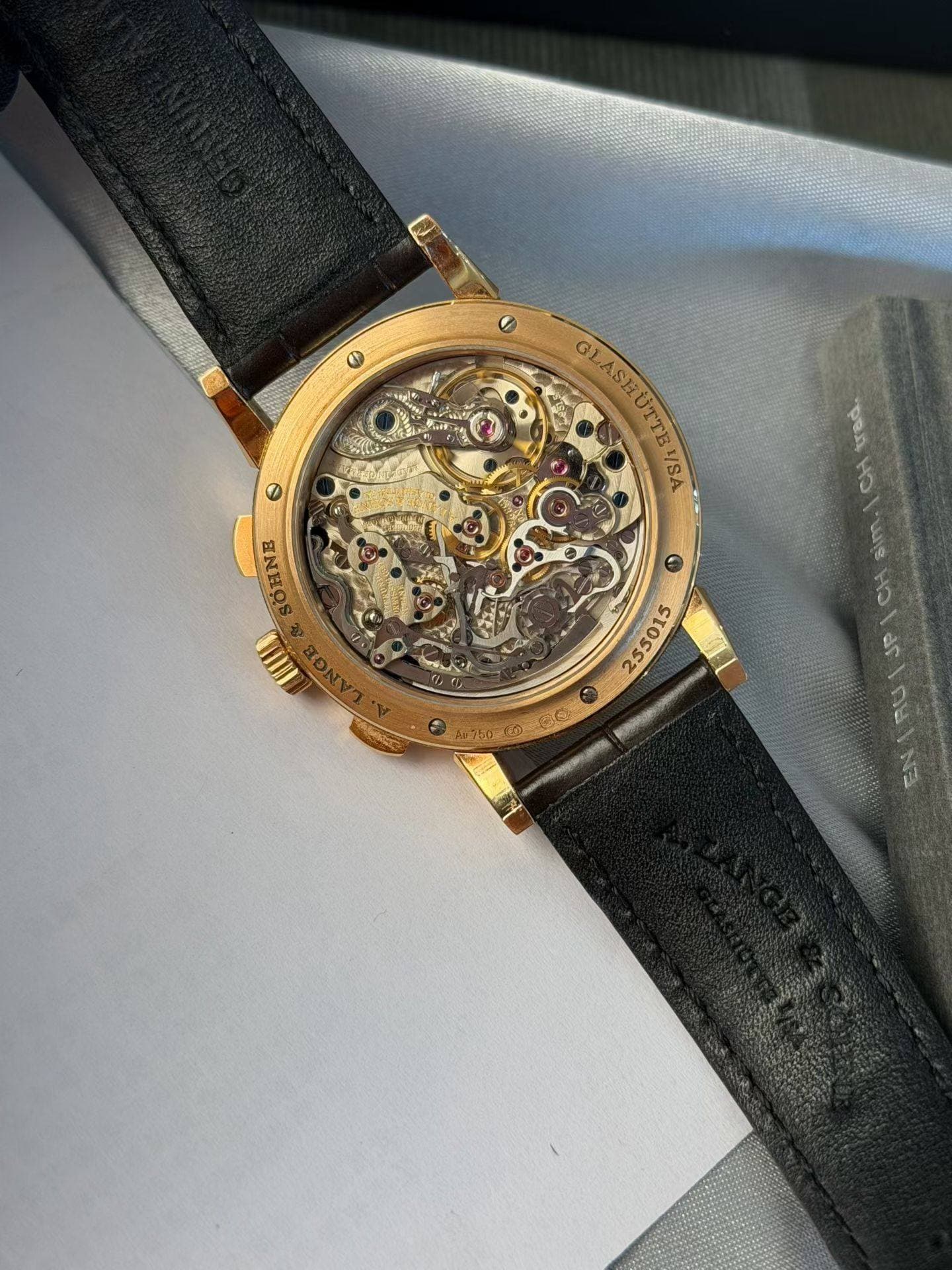 May be an image of wrist watch and text that says 'Θ O GLASHUTTEYSA VSA GLASHI LASHUTTE UTTI trad. SONNE WIIIL JP 455015 520M20 CONANON'