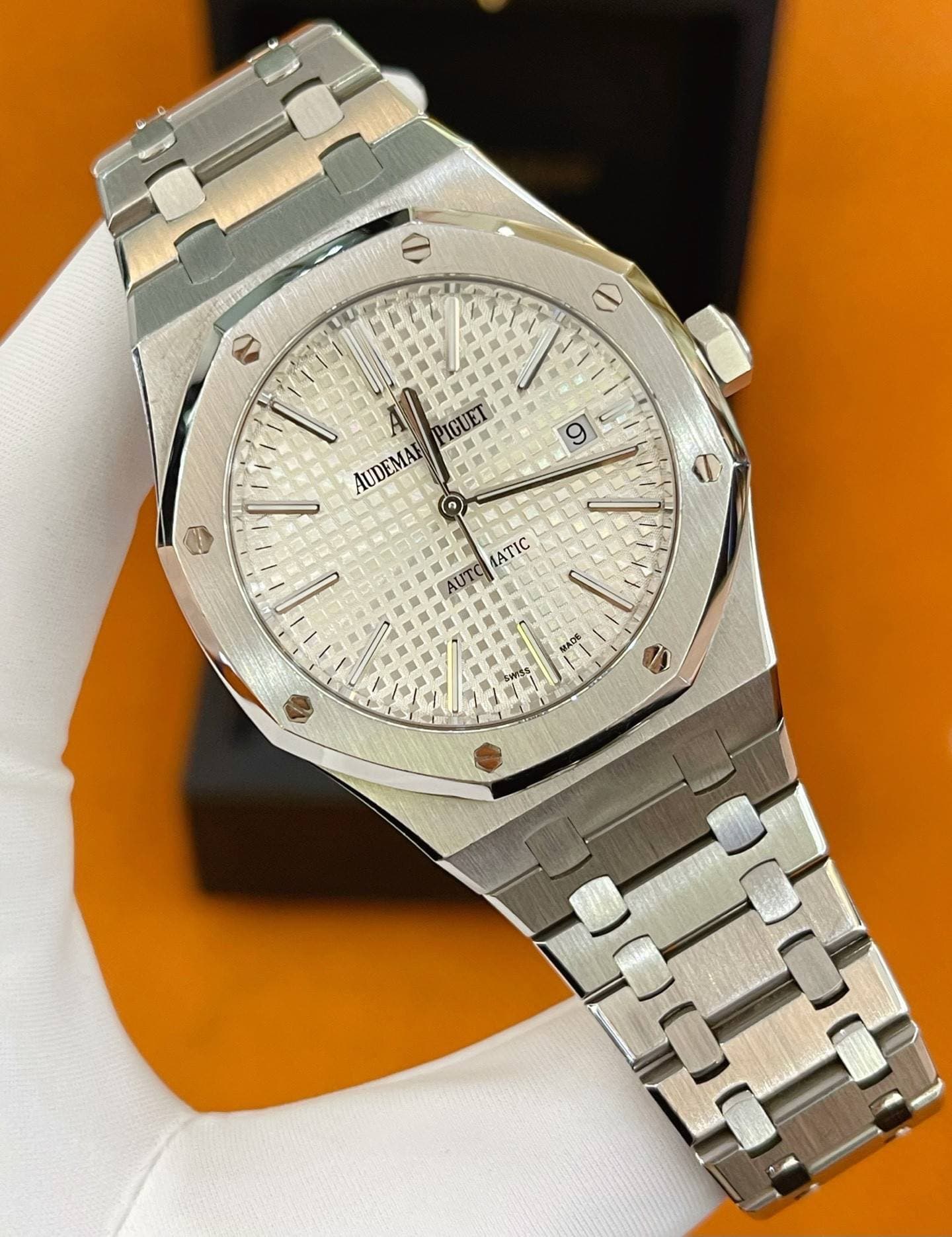 May be an image of wrist watch and text